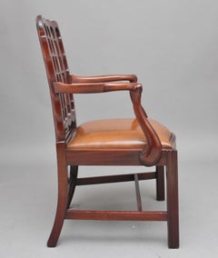 19th Century mahogany desk chair with shaped back and leather drop in seat