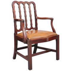 19th Century mahogany desk chair with shaped back and leather drop in seat