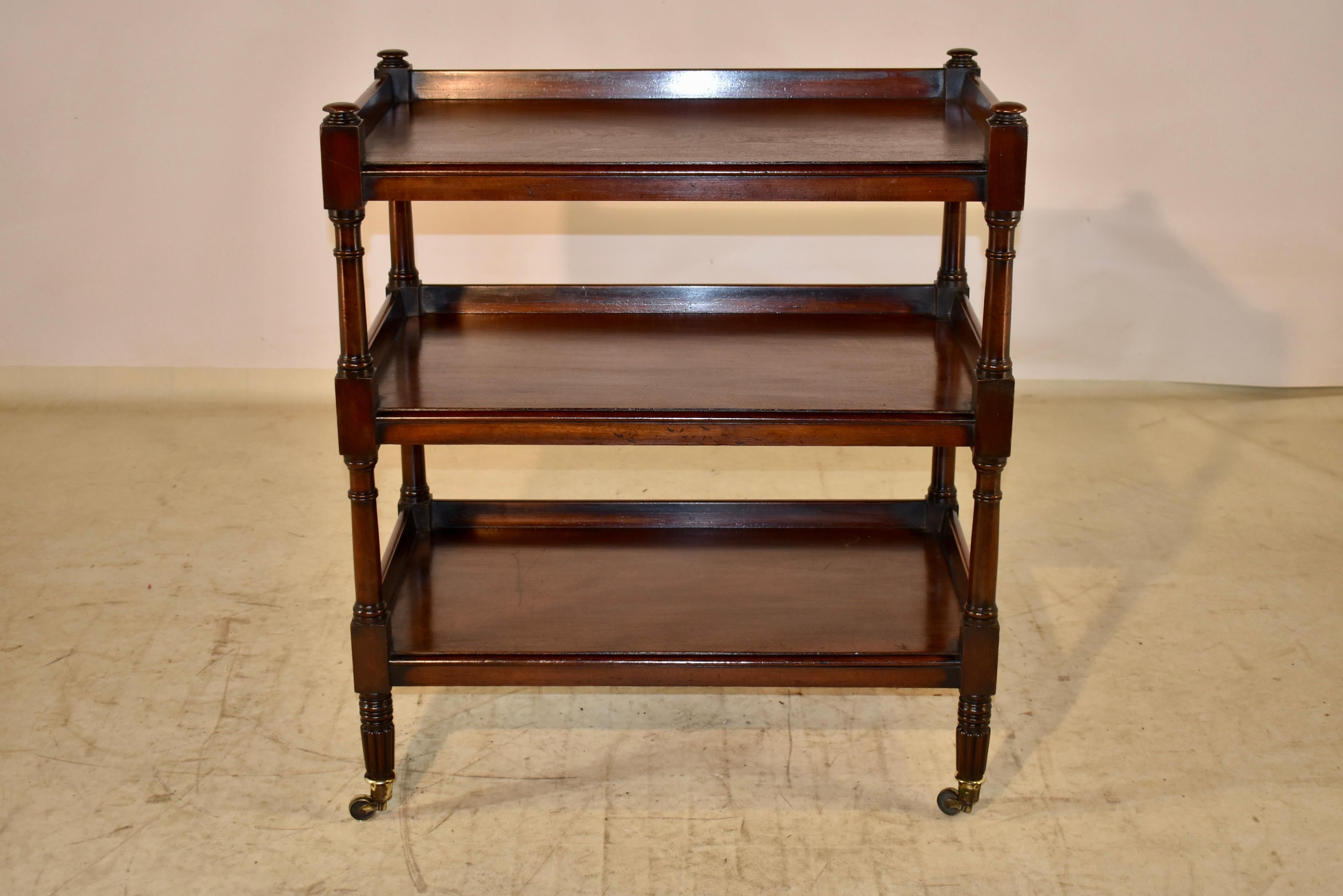 19th century Mahogany dessert buffet from England. the buffet has three shelves, all surrounded on three sides by galleries. The front edges of the shelves are beveled, and have simple aprons. The shelves are made from single boards, and are