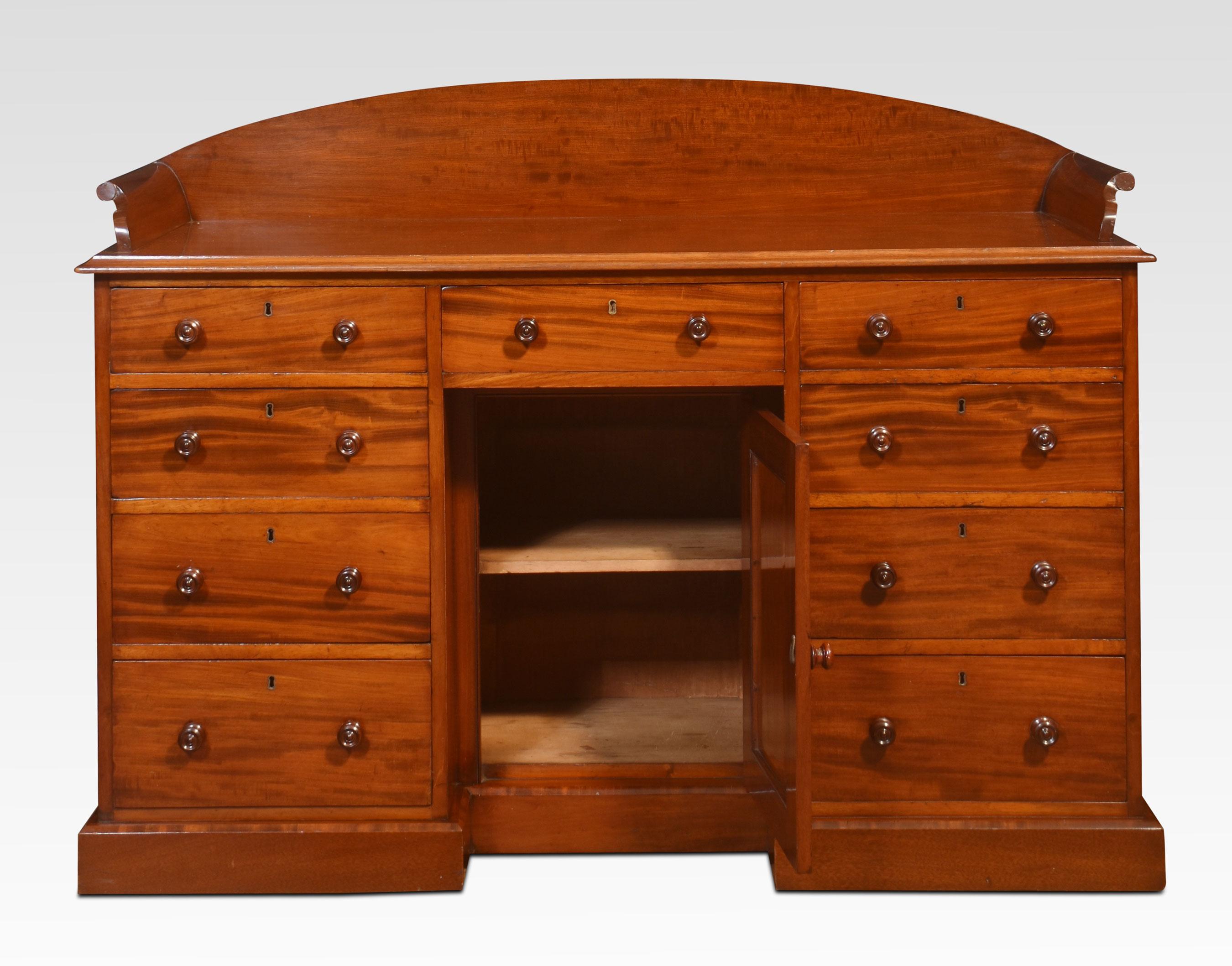 19th-century mahogany dressing table, the rectangular top with raised back and sides over an arrangement of nine graduated drawers, the locks stamped ‘Cope and Collinson’ and a single recessed cupboard to the centre kneehole. All raised up on a