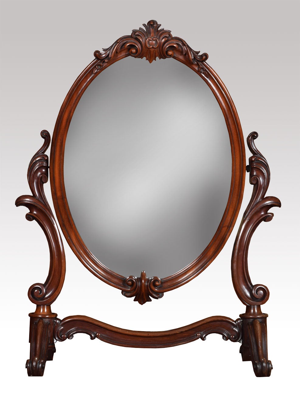 19th century mahogany dressing table mirrors the carved floral pediment to the oval plate mirror surrounded in mahogany frame all raised up on floral scroll supports

Dimensions

Height 34.5 inches

Width 26.5 inches

Depth 12.5 inches.