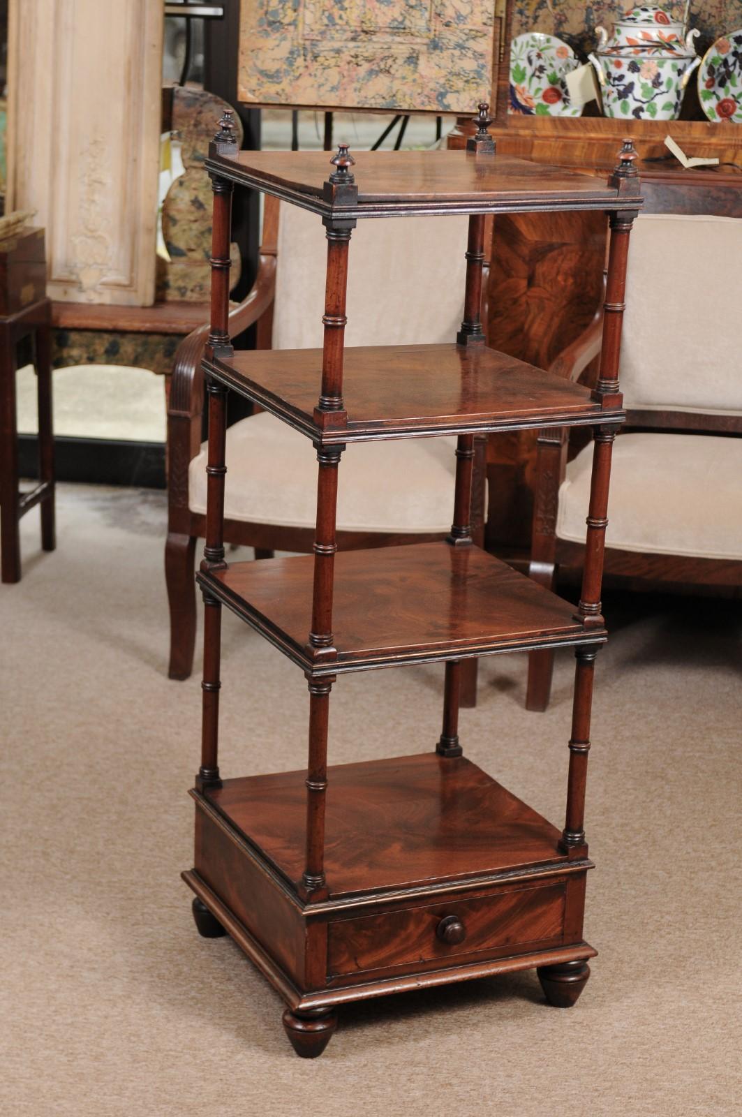 Mahogany 4-tier etagere with lower drawer and turned feet, 19th century continental.