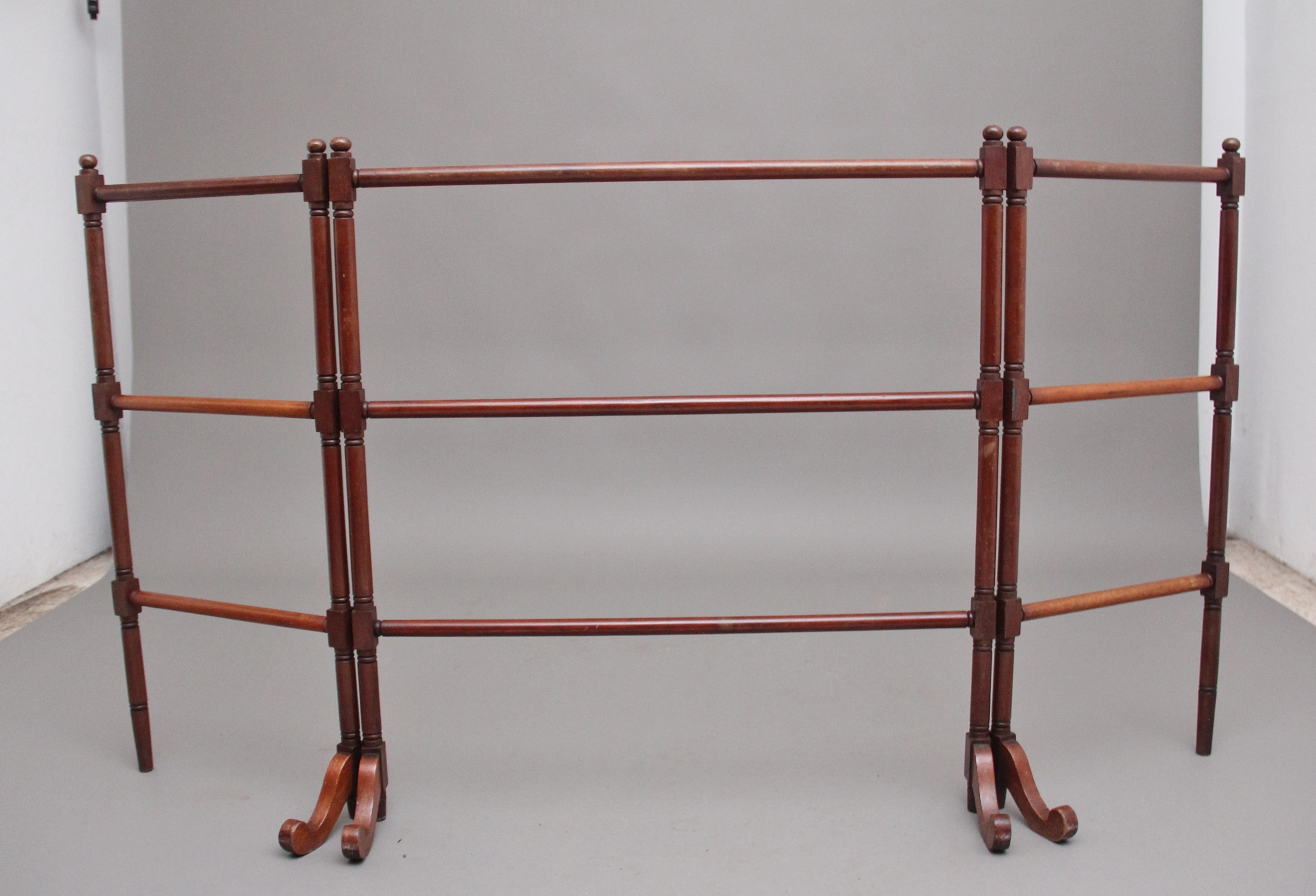 19th century mahogany folding towel rail made up of decorative turned rails and supported on shaped feet, circa 1870.