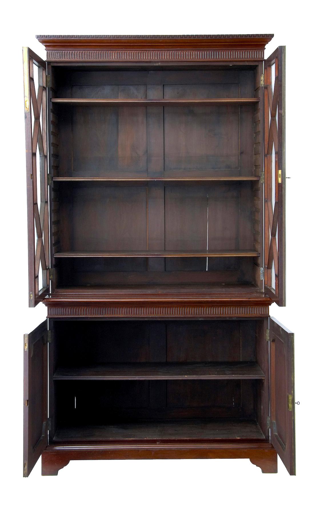 19th century mahogany glazed bookcase circa 1880
Comprising of 2 parts.
Top section with carved and fluted cornice. Double astral glazed doors open to reveal 3 adjustable shelves.
Bottom section with complementary fluting and a double door