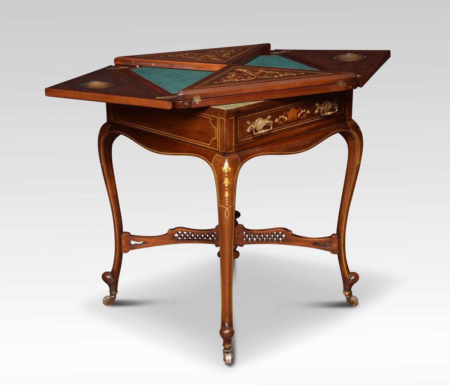19th century inlaid mahogany envelope card table, the four flap top having floral swags and flower headed inlay. Opening to reveal inset base playing surface with original copper cups. Above a single mahogany lined drawer with brass handles.