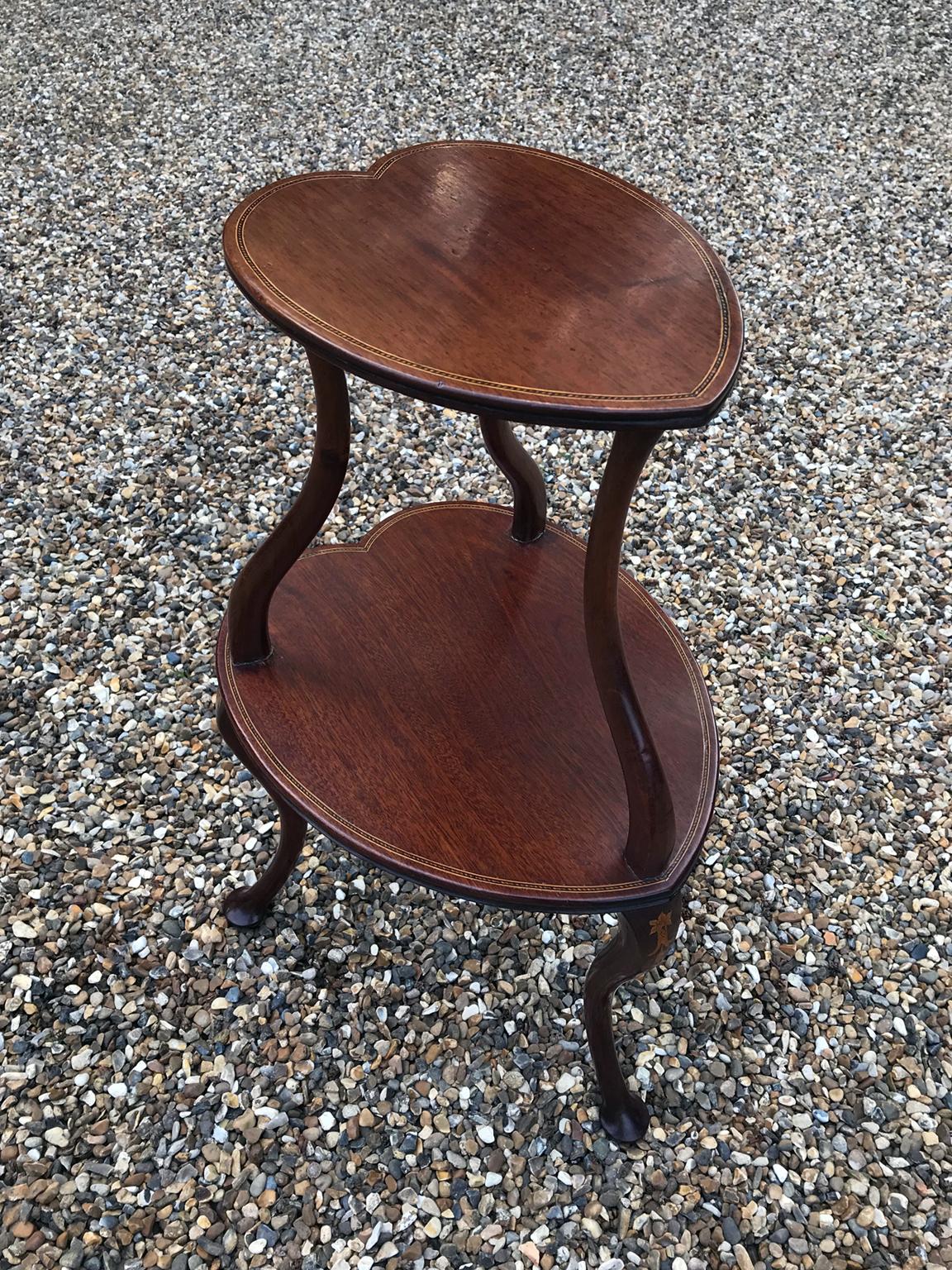 19th century mahogany inlaid heart shaped occasional table with 2 tiers and three splayed legs,

circa 1880

Dimensions:
Height: 24.5 inches - 62 cms
Width: 12 inches - 31 cms
Depth: 14.5 inches - 37 cms.

 