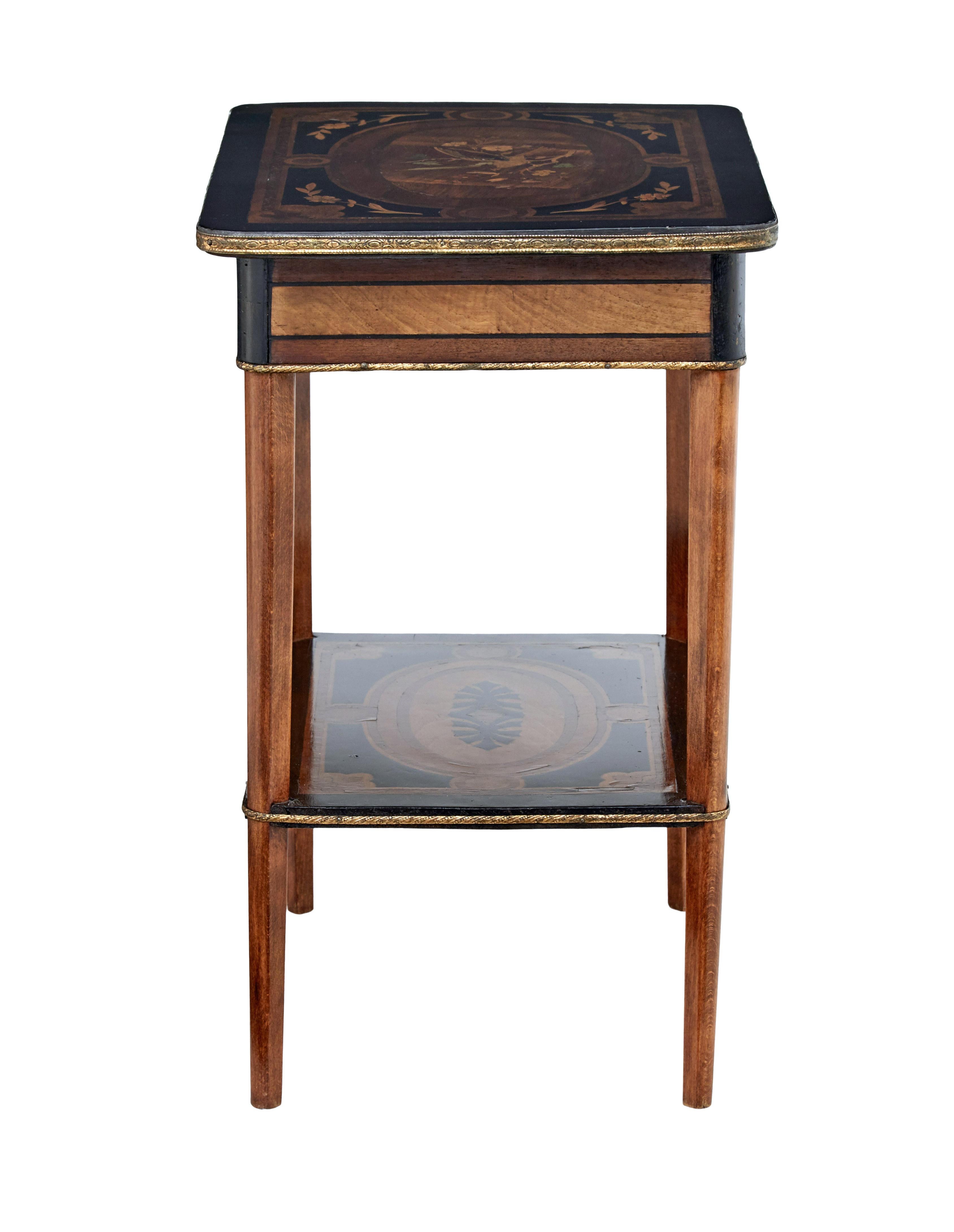 19th century mahogany inlaid ladies work table, circa 1880.

Beautiful multiple wood inlaid top depicting a bird among a branch and florals. Ebonized with borders and swags. Top opens to reveal a fitted interior with partitions and polished brass