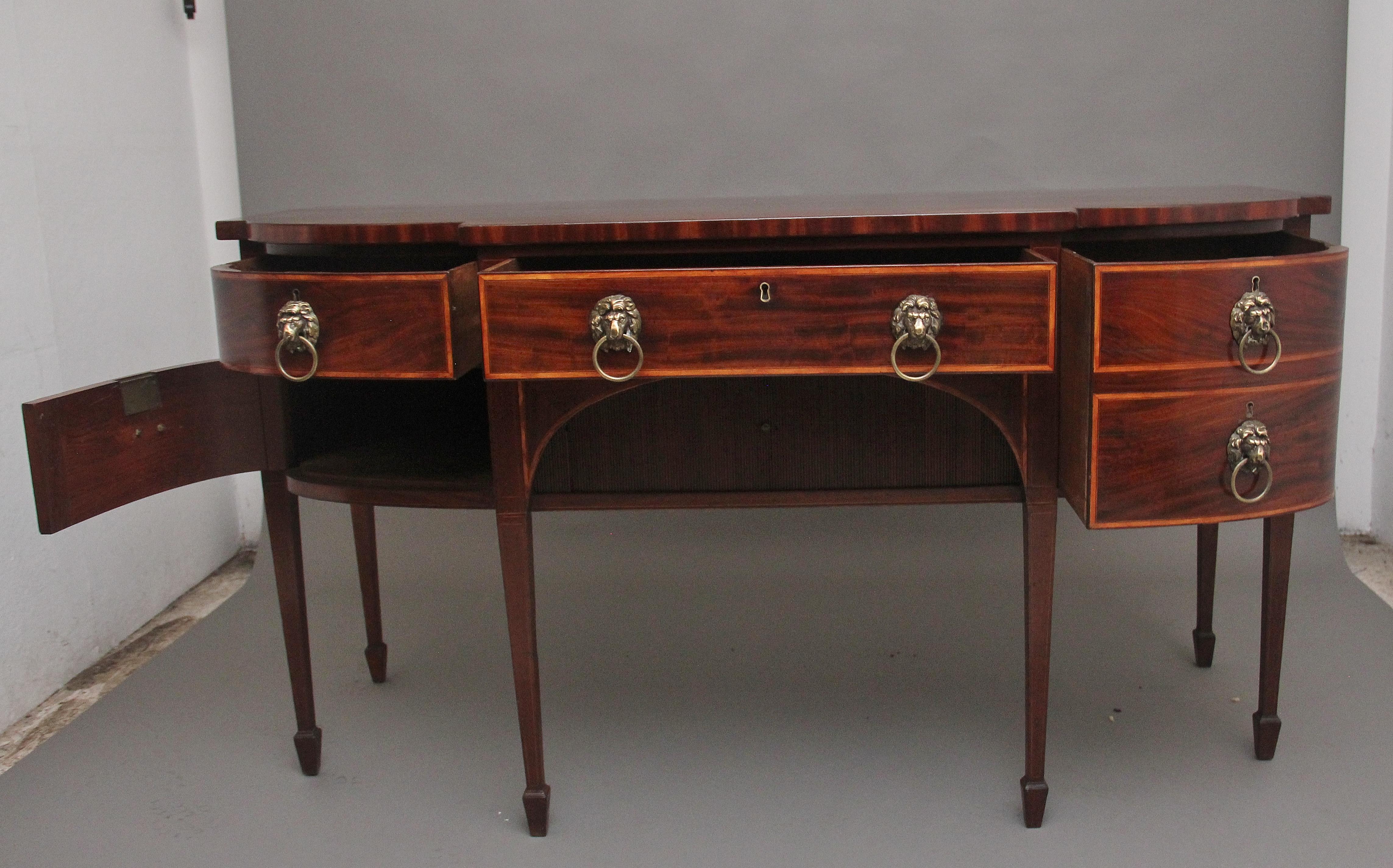 A superb quality early 19th Century mahogany inlaid bowfront sideboard, having a lovely figured top above a central drawer flanked either side with a single deep drawer to the right and a drawer to the left with a cupboard below, all drawers are oak