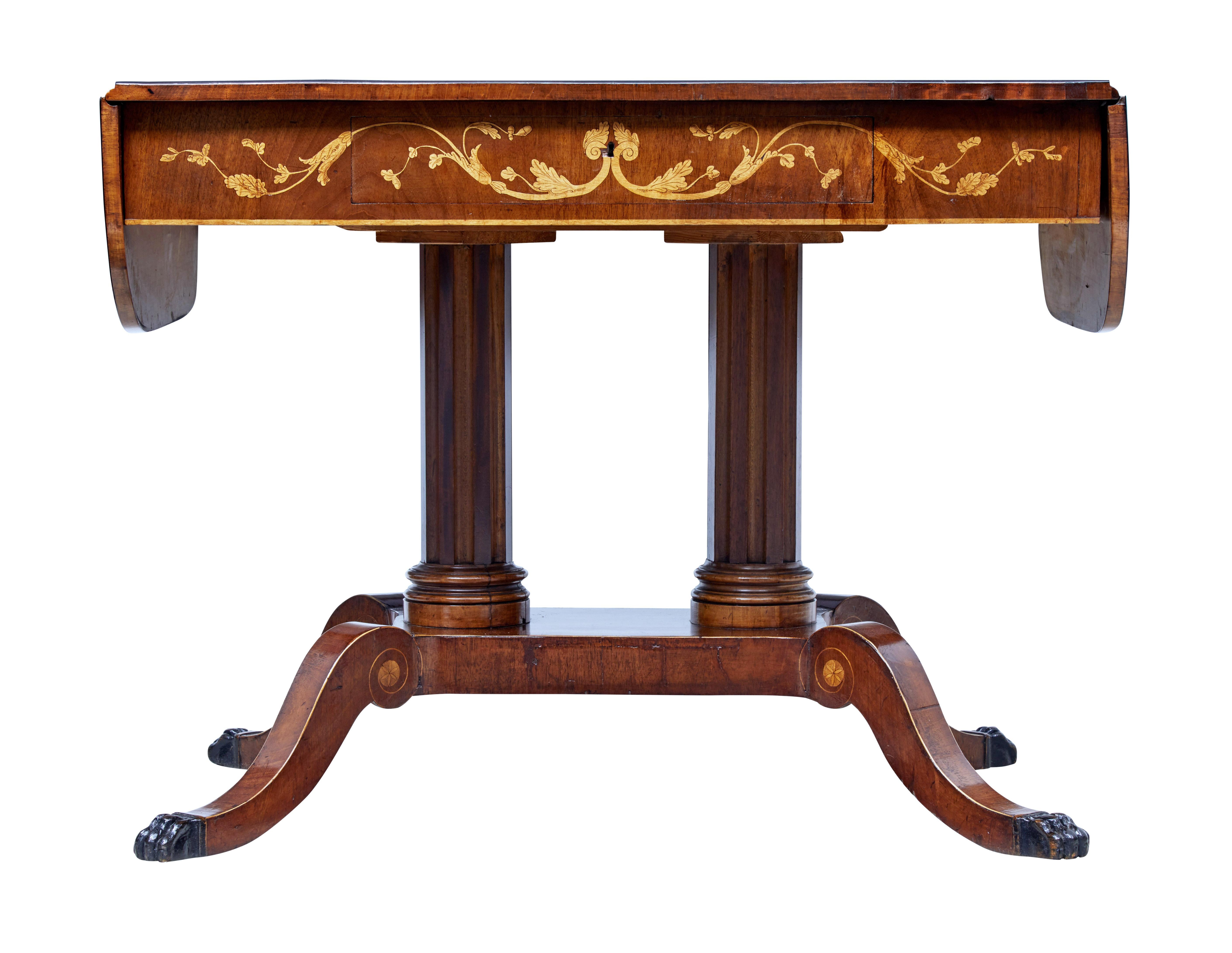 19th century Swedish mahogany inlaid sofa table, circa 1860.

Free standing sofa table with drop down flaps. Plain mahogany top with ebonised outer edge. Single drawer to the front with birch swag inlay, which is repeated on the