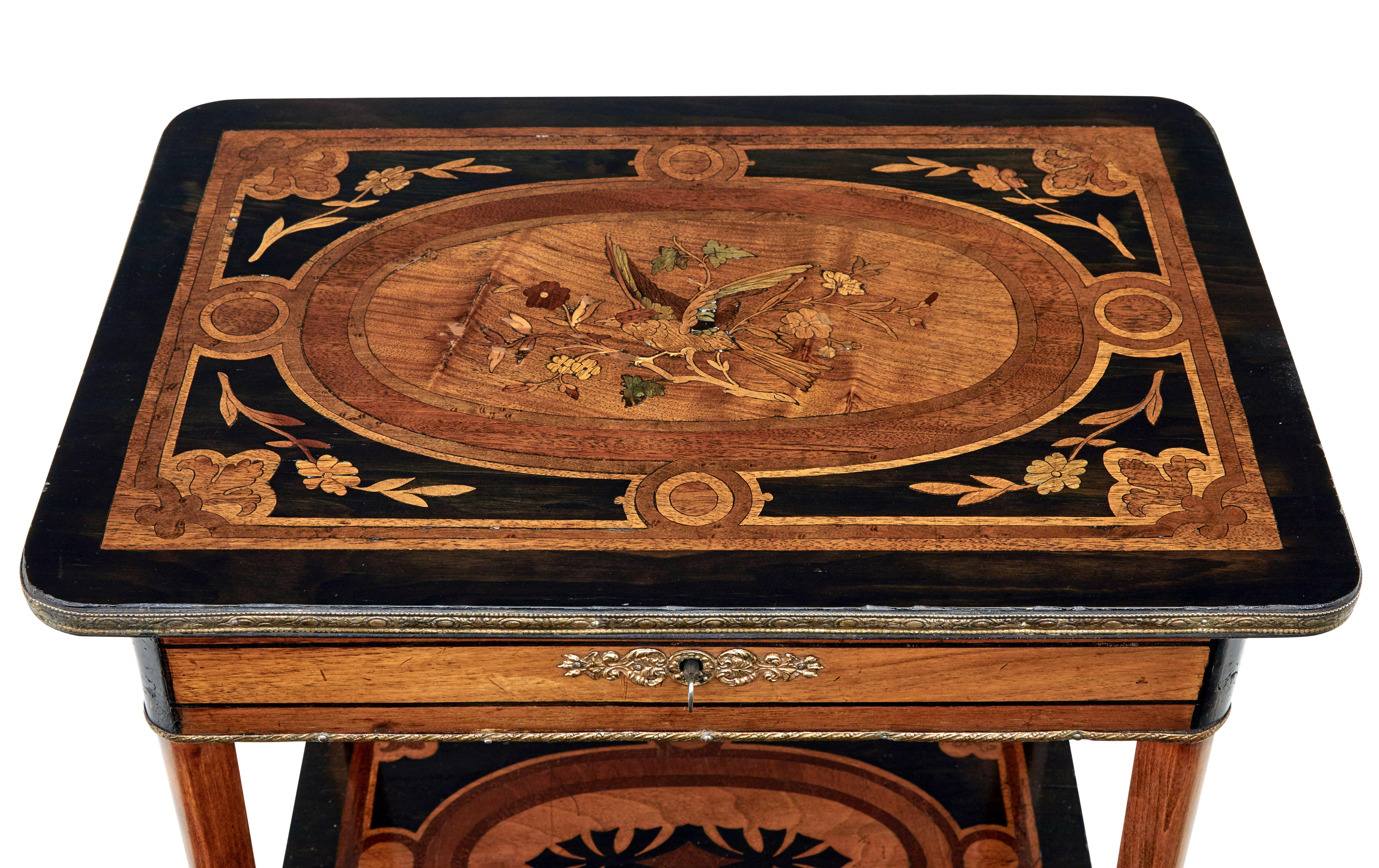 19th century mahogany inlaid ladies work table, circa 1880.

Beautiful multiple wood inlaid top depicting a bird amoung a branch and florals.  Ebonised with borders and swags.  Top opens to reveal a fitted interior with partitions and polished