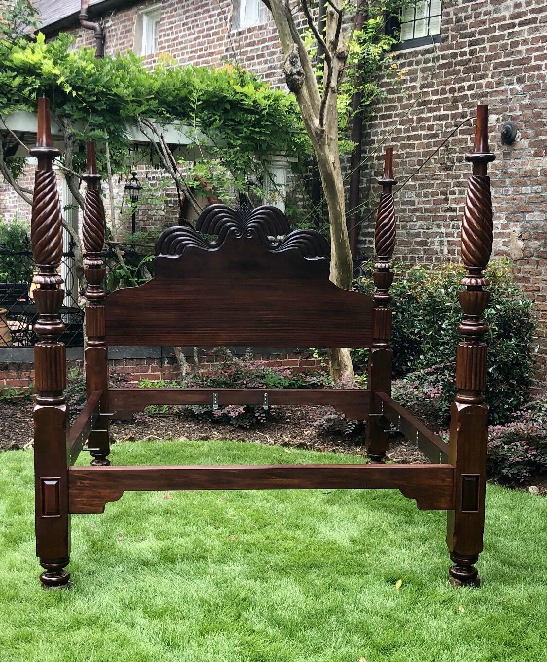 This elegant Caribbean mahogany bed was constructed in the 19th century in Jamaica. This Rare West Indies Bedstead exhibits a scarce and desirable hand carved iconic Jamaican Double Waterfall headboard which resonates with the four solid mahogany