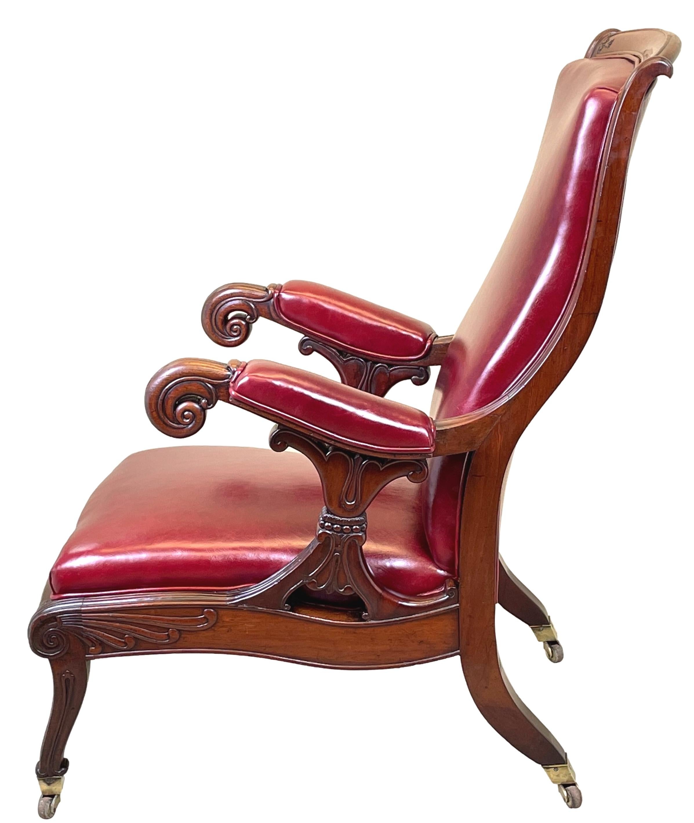 A superb quality mid-19th century William IV period mahogany library armchair of bold proportions having swept and scrolling arms with superbly carved x framed supports, over large bucket seat raised on extremely elegant sabre legs with original