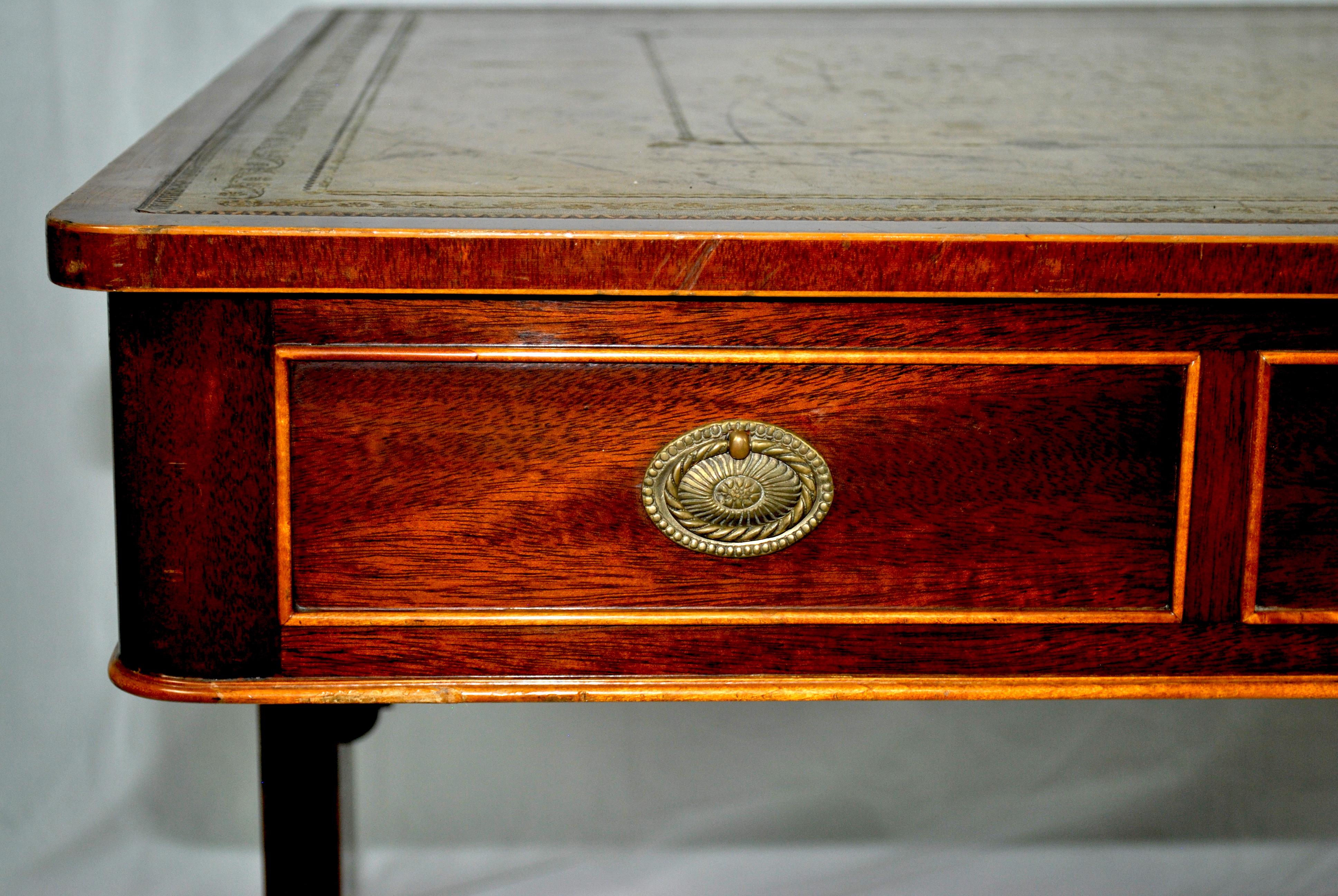 Flame mahogany library table with its original leather, circa 1820.