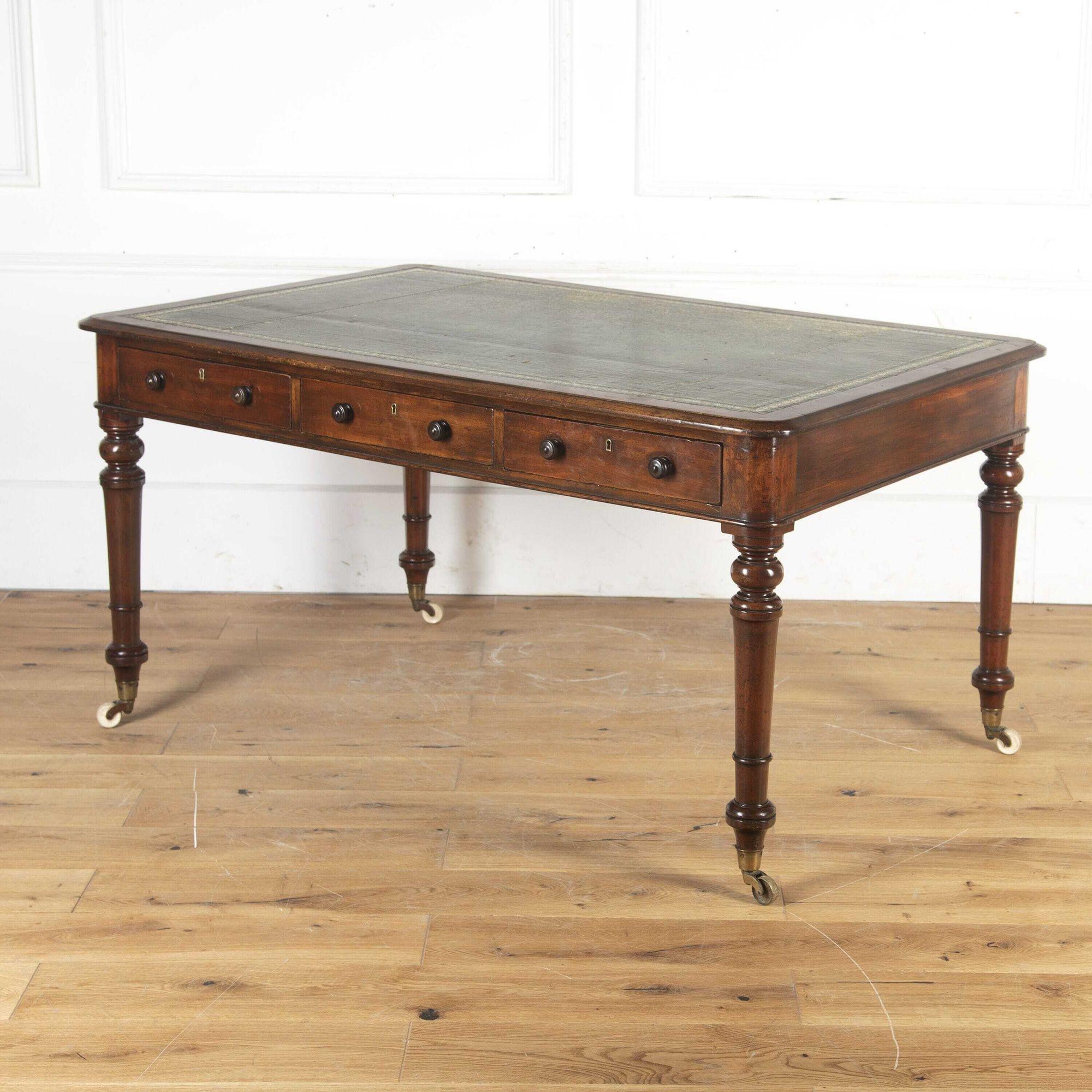 Fine quality 19th Century mahogany library table or partners' desk.
This beautiful table is designed to free-stand in a room, with six drawers - three to each side of the frieze. It retains its old worn gilt-tooled green leather inset to the top.