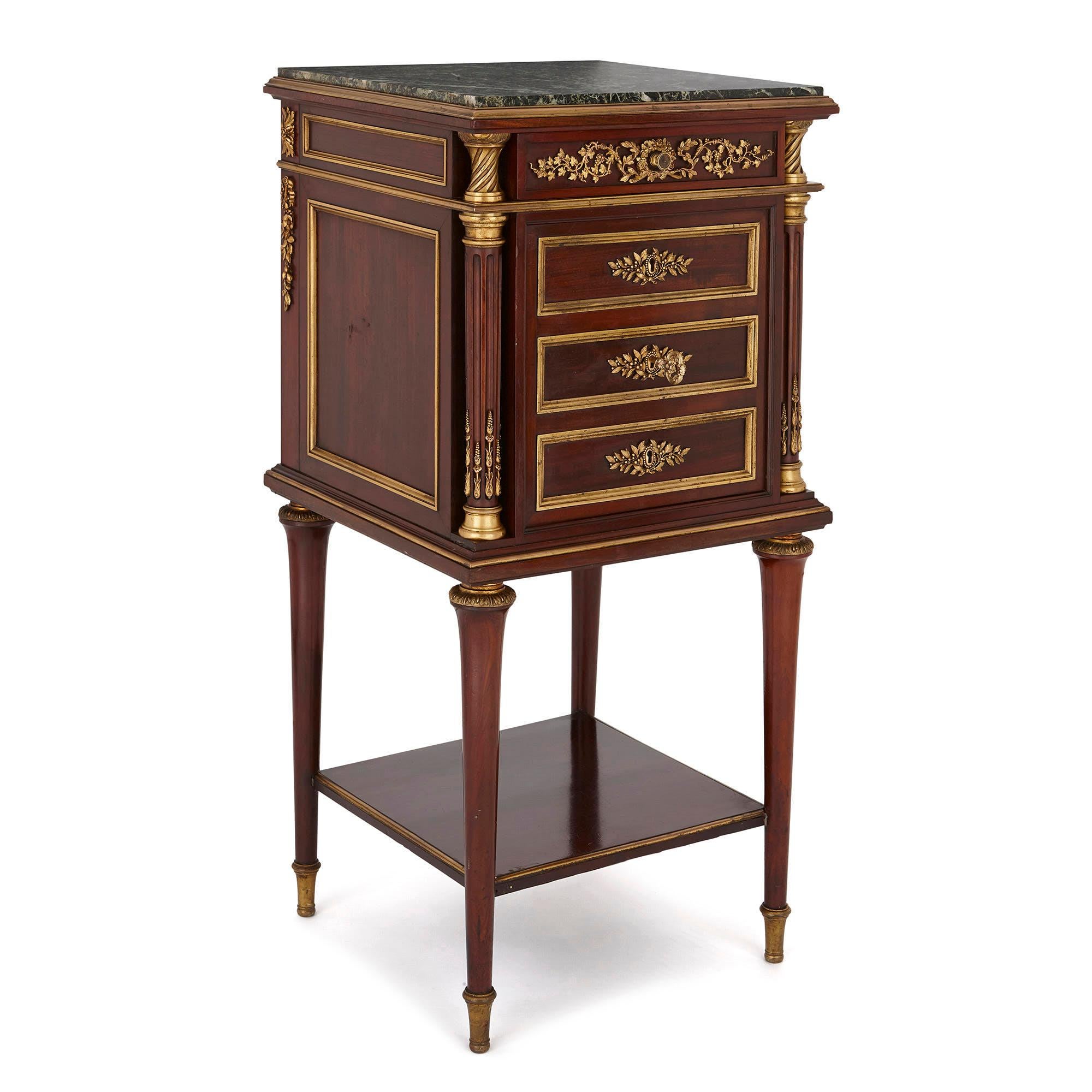 Created in the late 19th century, this beautiful cabinet is designed in the style of furniture produced in the Louis XVI period (1774-1793). This period saw the emergence of a refined Neoclassical style which was subsequently called the Louis XVI or