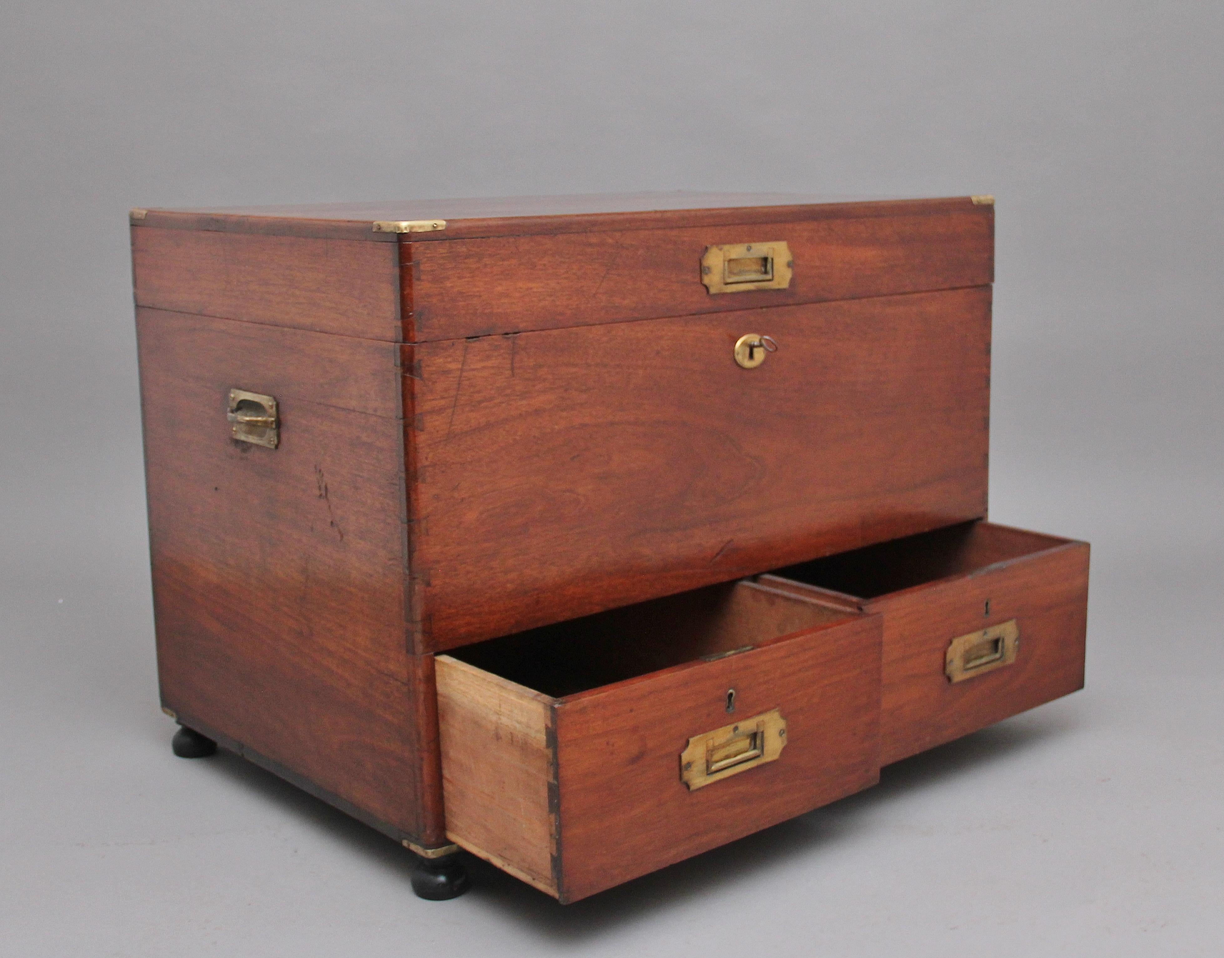 A lovely quality and rare 19th century mahogany military mule chest, having the original brass hardware comprising of brass corners, recessed handles and carrying handles at the sides, the hinged lift up top opening to reveal a large compartment,