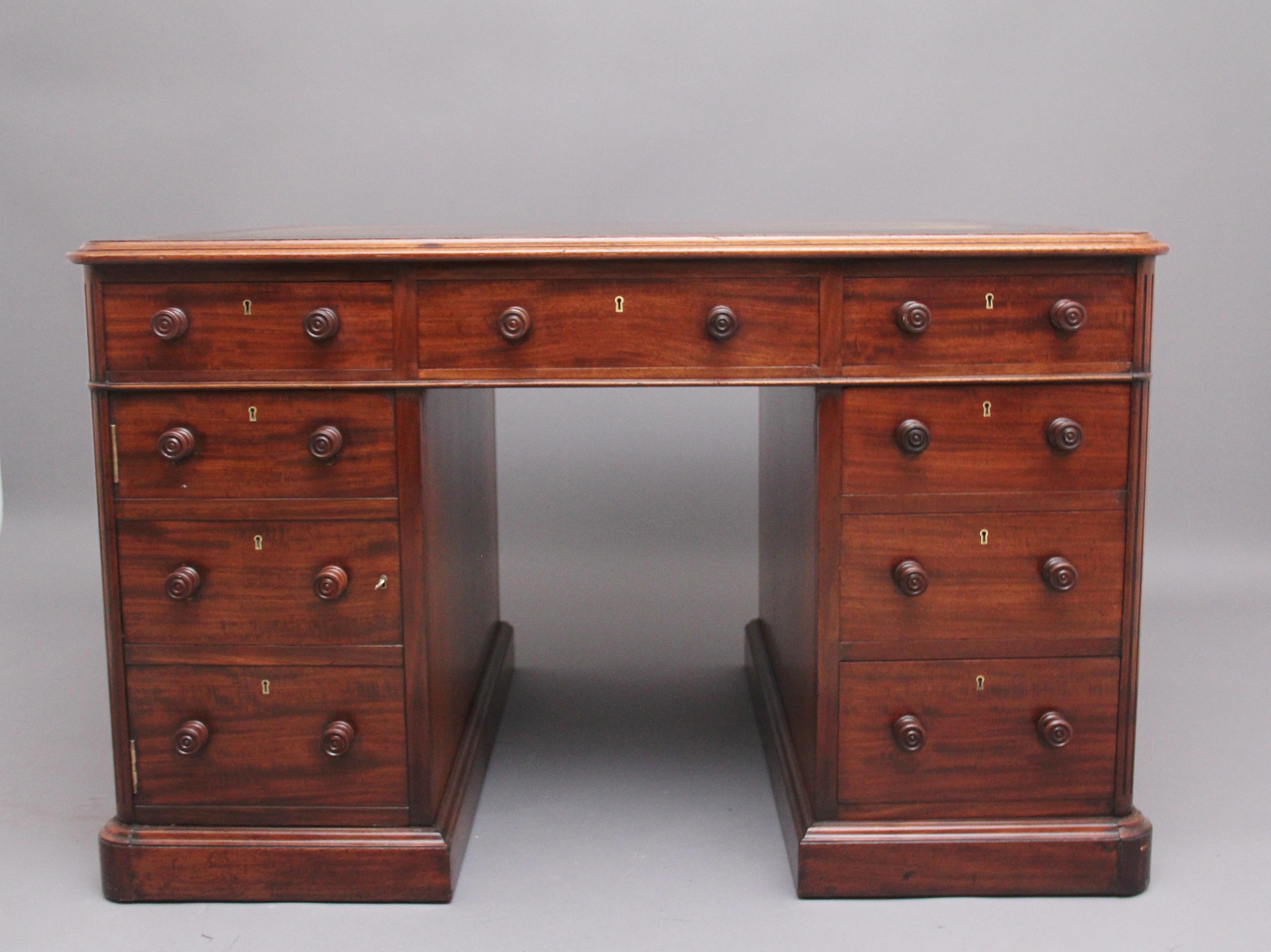 A superb 19th Century mahogany partners desk stamped Gillows, the thumb moulded edge top having a green leather writing surface decorated with blind tooling, each side of the desk having an arrangement of six graduated drawers and cupboard opening