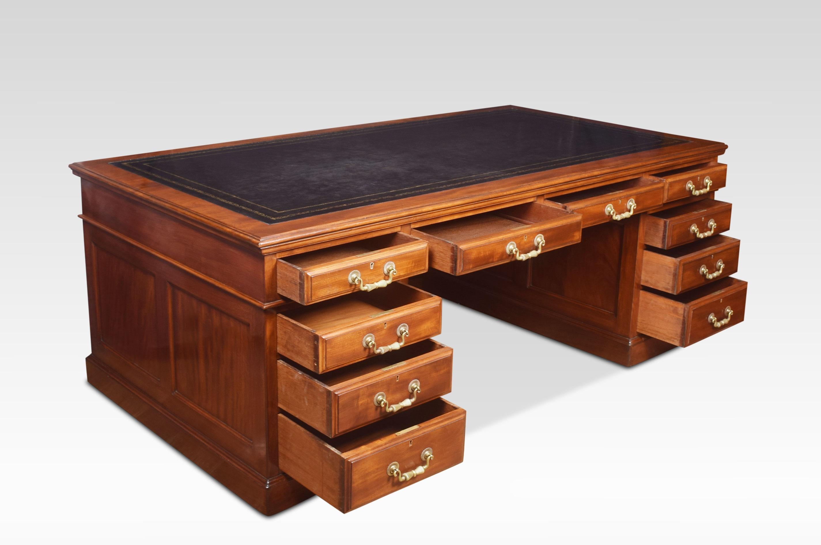 19th century mahogany partners ooor library desk, the very large rectangular black hide top with a gilt-tooled border enclosed by a moulded edge over an arrangement of four frieze drawers fitted with bold brass tooled handles. Above two large