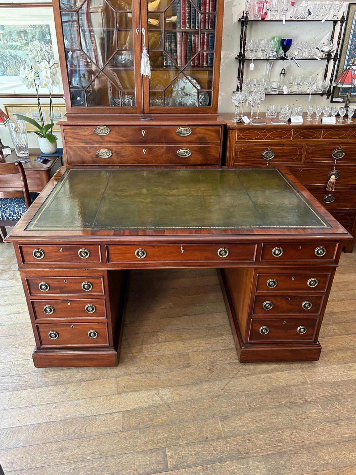A very high quality 19th Century Mahogany Partners Pedestal Desk with makers plate – S&H Jewell London Cabinet Makers with tooled leathered writing surface. 12 drawers and 2 cupboards with solid oak lined drawers and original brass ring handles on