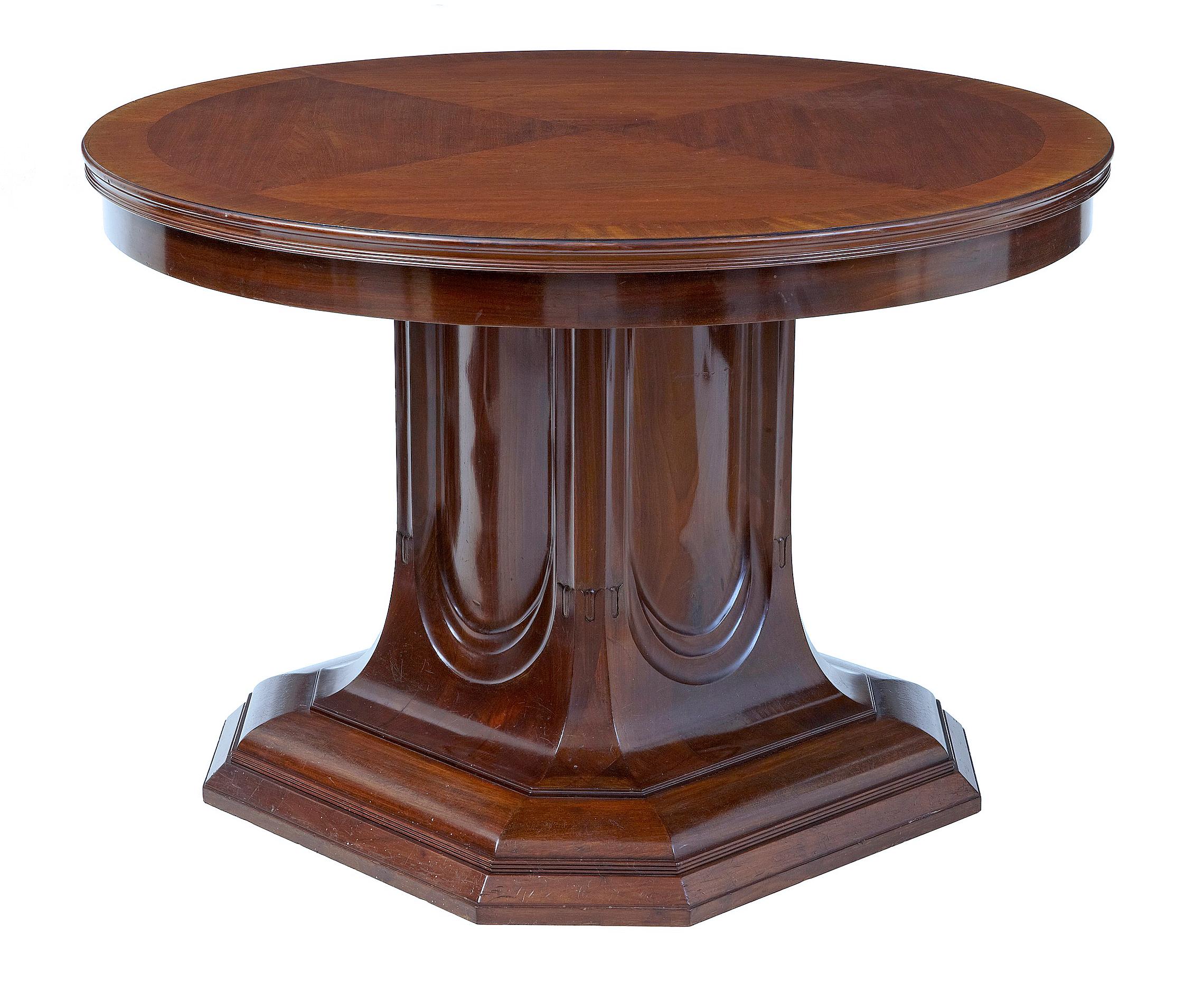 19th century mahogany pedestal base center table circa 1890.

Circular top which has been quarter veneered with a cross banded outer edge. Supported by a unusual architectural 4 sided pedestal base, standing on a 8 sided plinth base.

Some