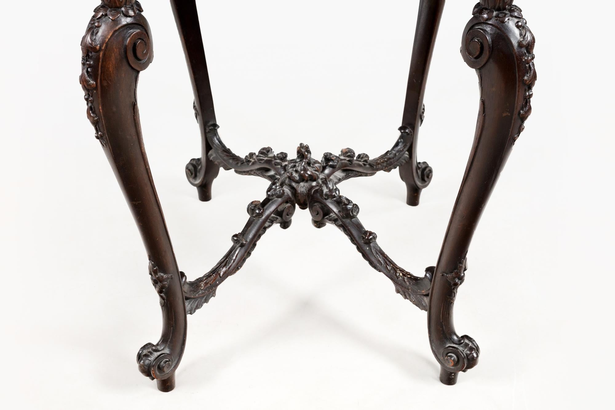 19th Century mahogany Pembroke table with Chippendale-style legs. This table features delicate beaded edging on the twin fold-out leaves which sit above a single end drawer with circular brass handles and simple inlay detailing, balanced by a false