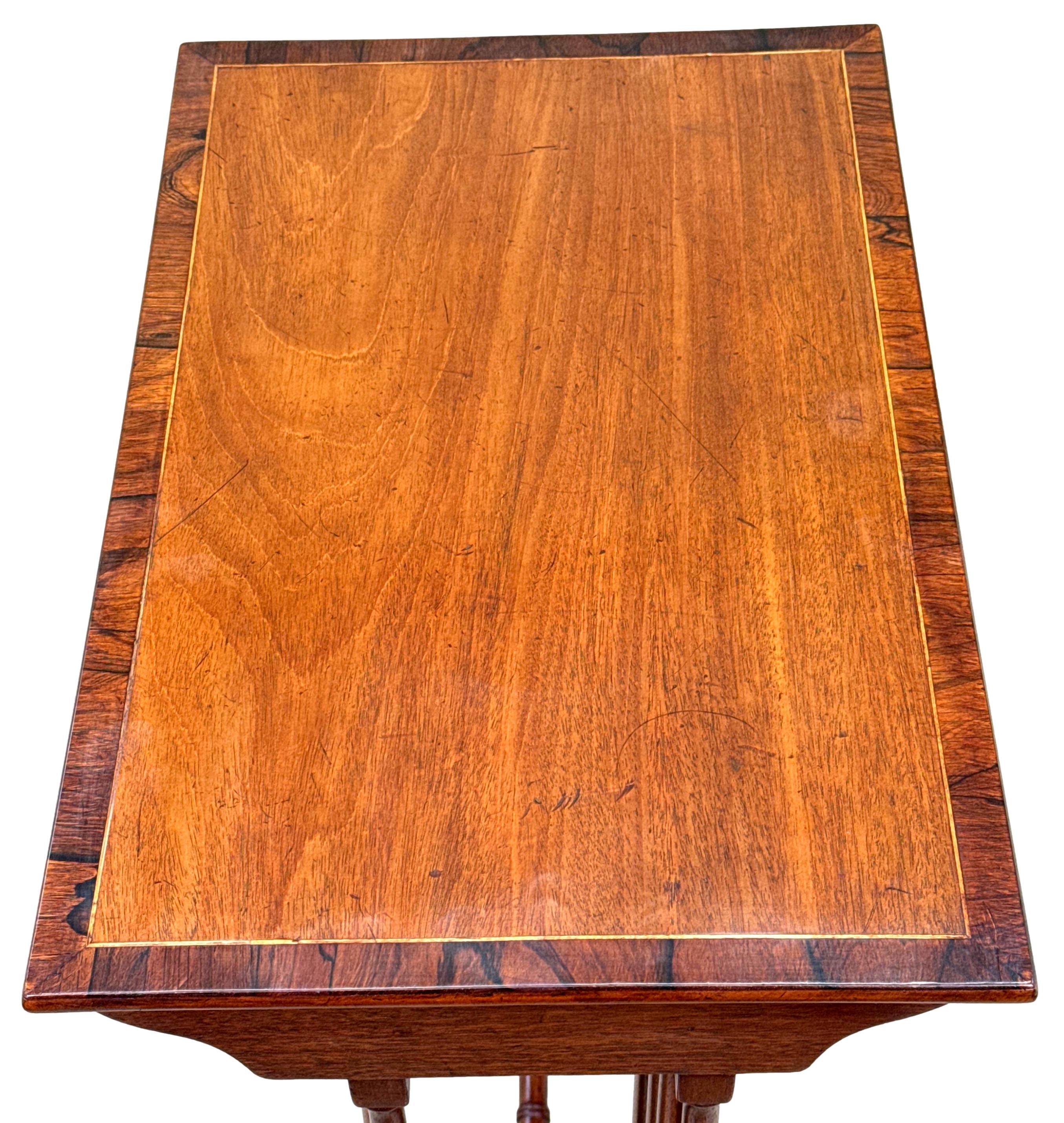 A Very Good Quality Mid 19th Century Mahogany Quartetto Nest Of Four Rectangular Coffee Tables, Having Well Figured Tops With Crossbanded & Strung Decoration, Raised On Elegant Turned Upright Supports, United By Cross Stretchers. Terminating On