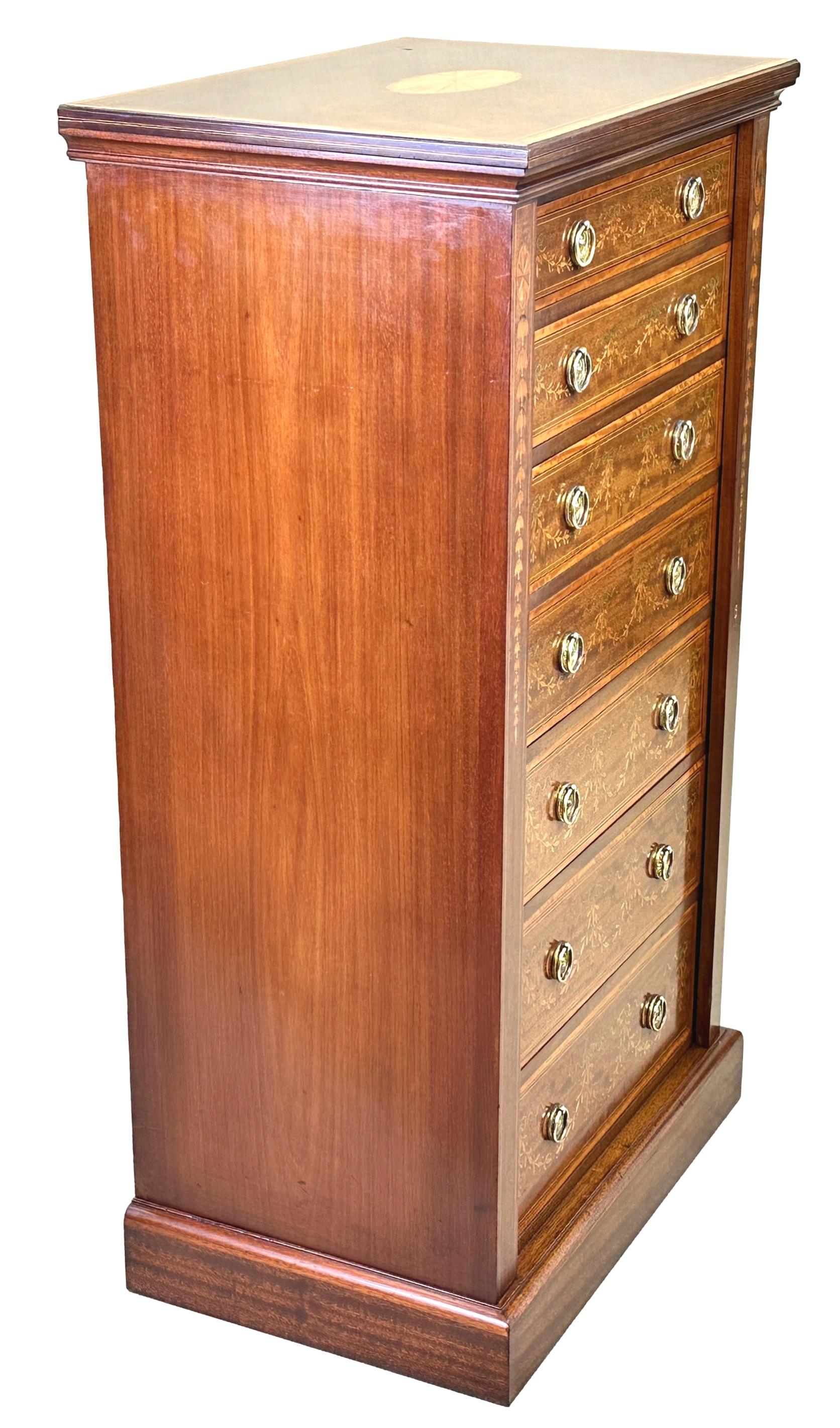 An Exceptional Quality Late 19th Century Mahogany And Satinwood Wellington Chest Of Drawers, Having Superbly Figured Rectangular Top With Inlaid And Crossbanded Decoration, Over Seven Mahogany Lined Drawers With Profuse Inlaid Decoration And