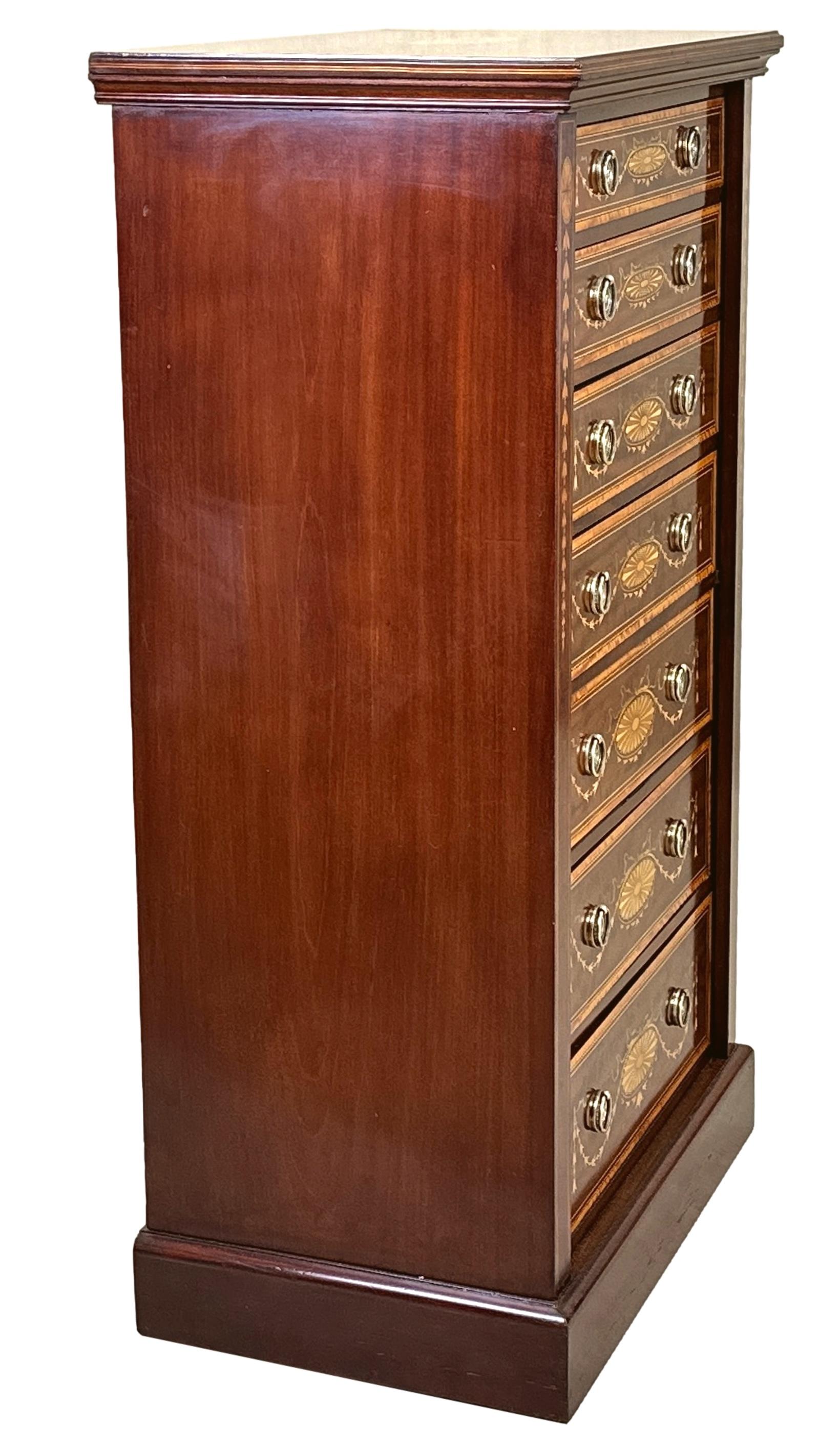 An Exceptional Quality Late 19th Century Mahogany And Satinwood Wellington Chest Of Drawers, Having Superbly Figured Rectangular Top With Inlaid And Crossbanded Decoration, Over Seven Mahogany Lined Drawers With Profuse Inlaid Decoration And