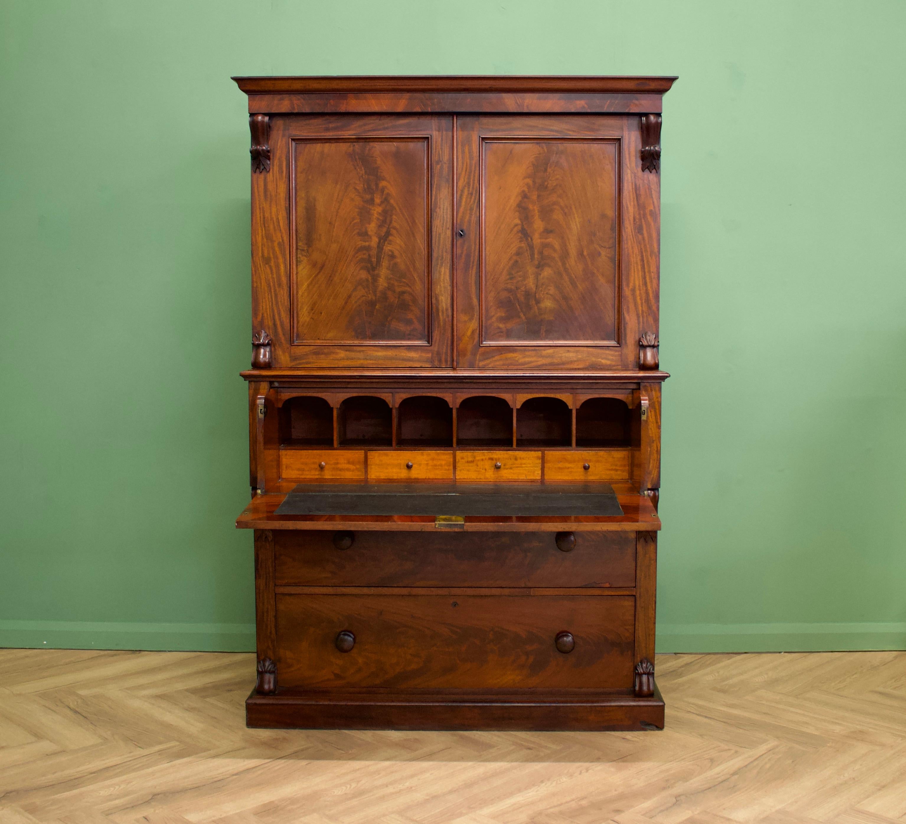 A late Georgian/early Victorian secretaire bookcase
There's a lockable cupboard to the top
A pull out desk with internal drawers and compartments
Two additional drawers to the bottom.