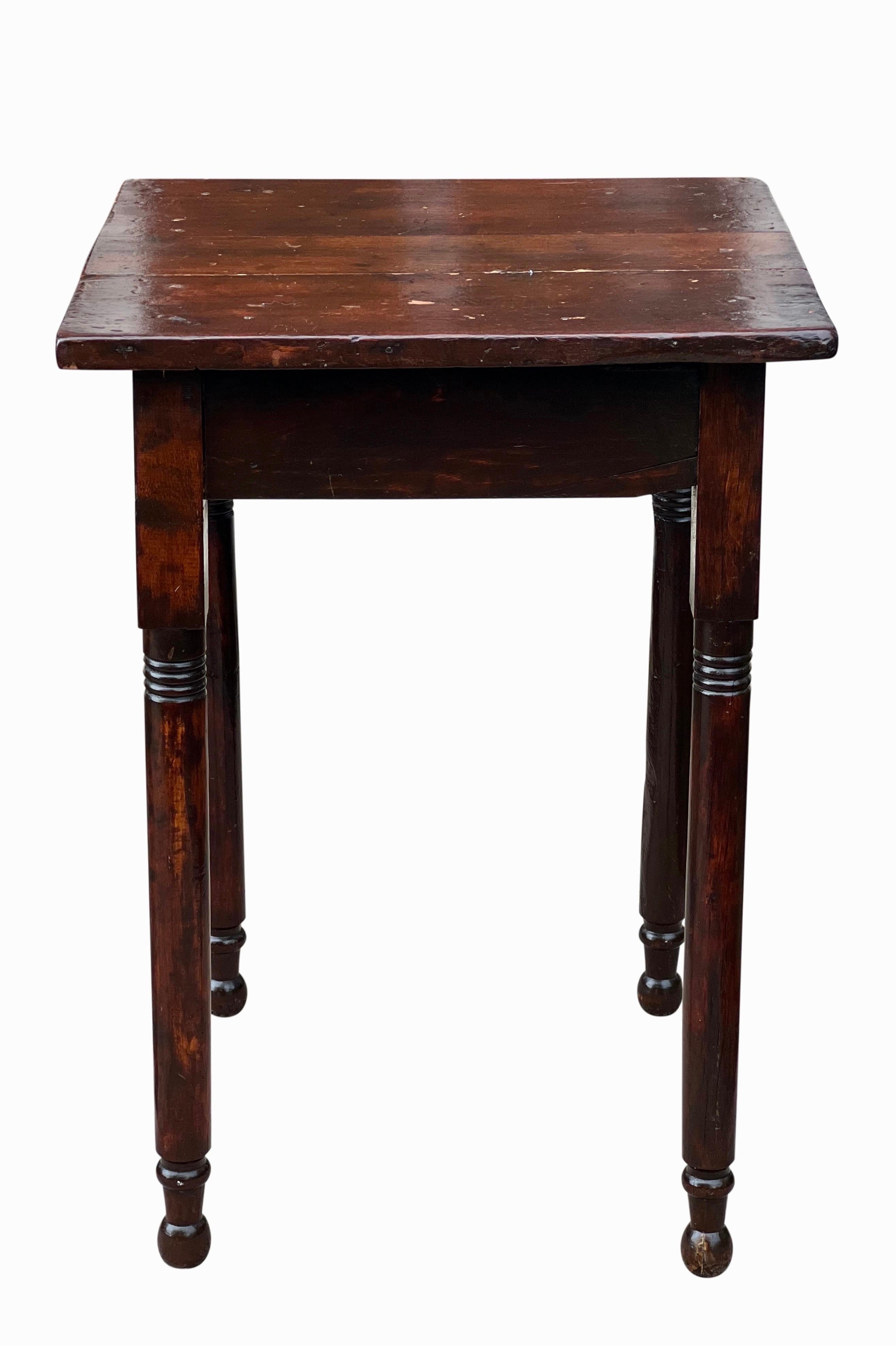 Antique mahogany small work table, side table or plant stand, circa 1860's.

Charming table with great patina and lots of rustic character.  It has a simple design with understated details including turned legs and a plank top.  Well crafted and