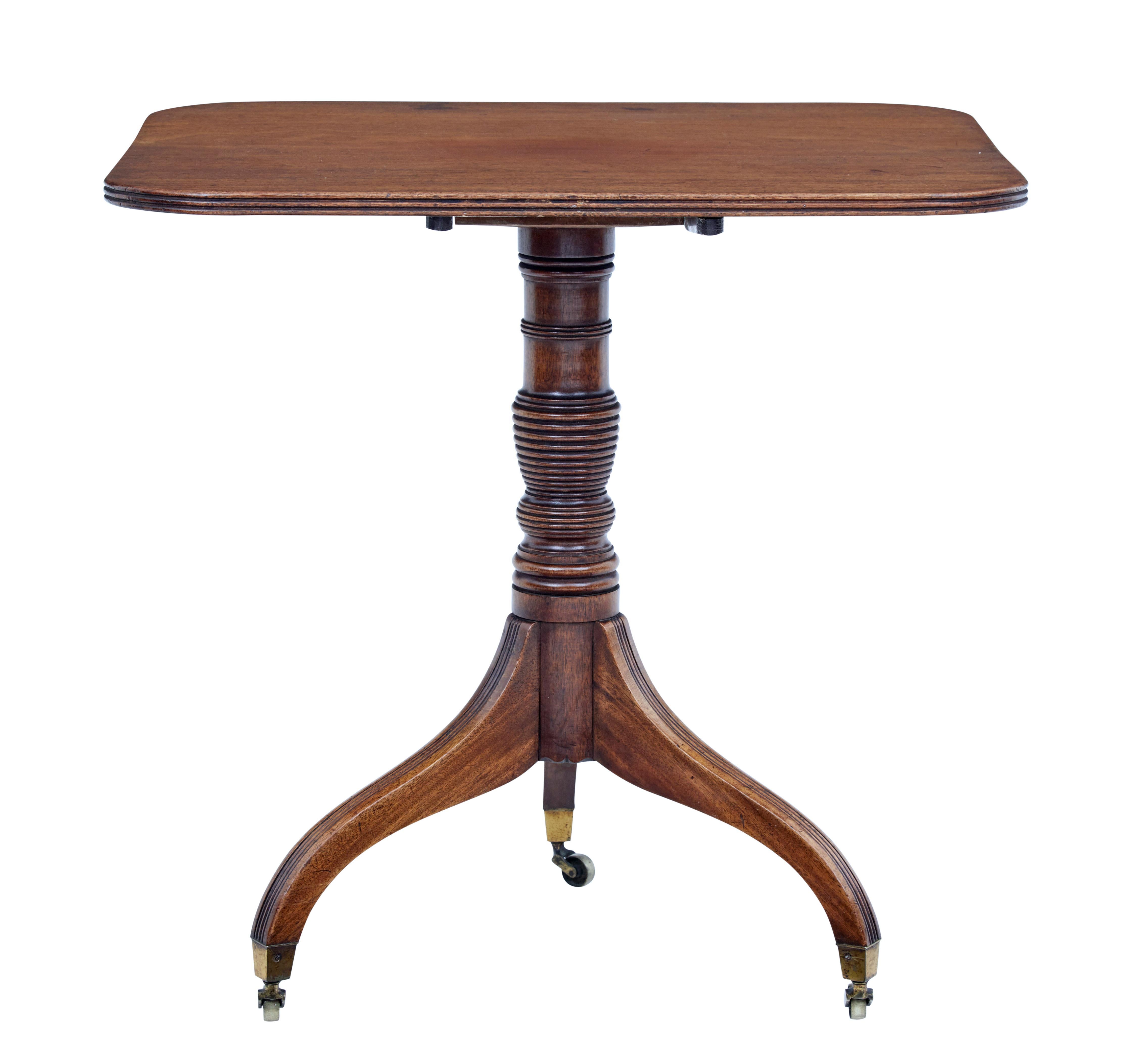 English 19th century table, circa 1880.

Rectangular top with reeded edge, tilting top mechanism. Turned stem, standing on 3 legs with brass castors.

Ideal for use as a lamp table or behind a free standing sofa.

Some staining and natural