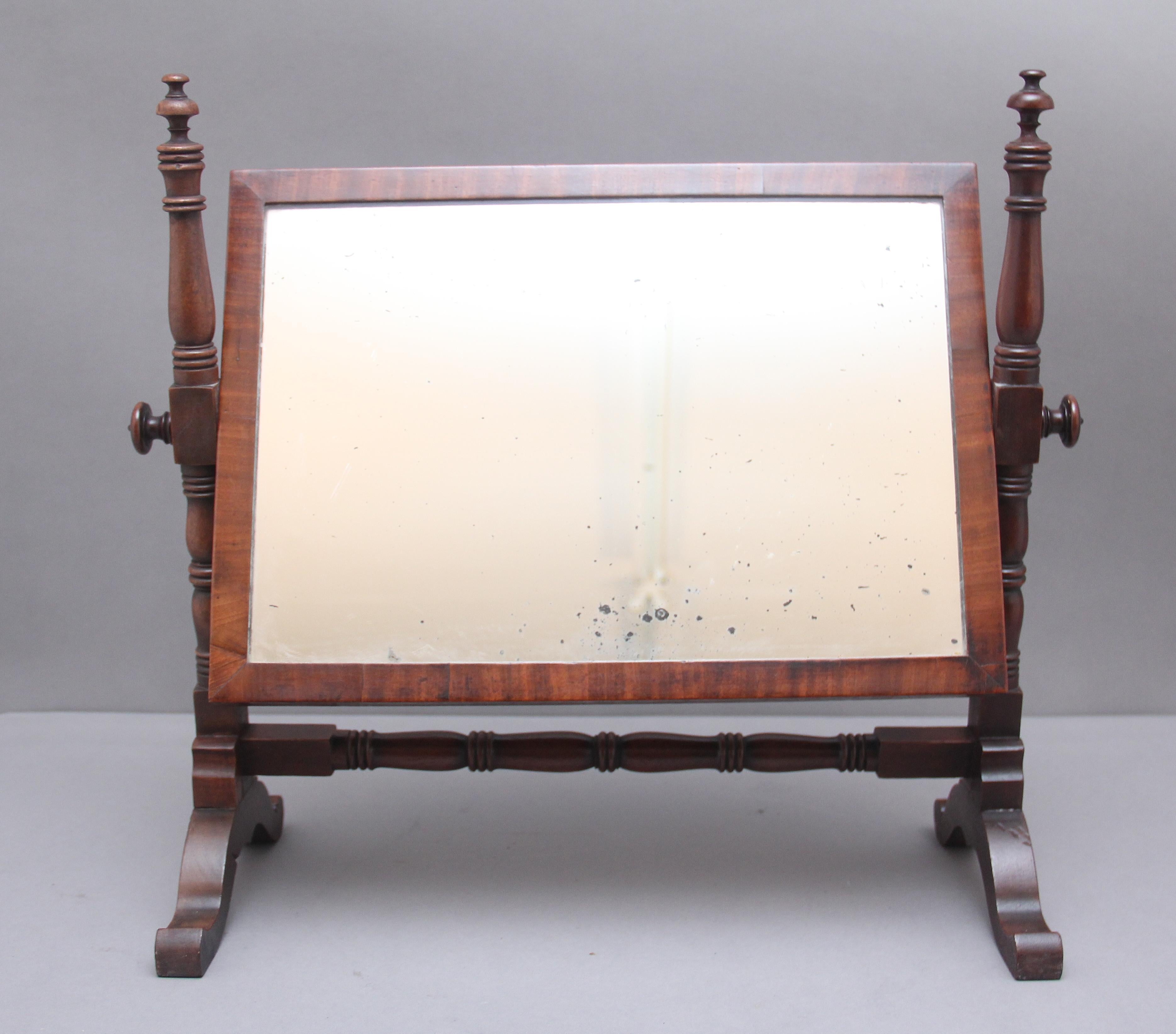 19th century mahogany toilet mirror, the adjustable mirror having the original glass, elegant turned column supports raised on shaped feet united by a turned stretcher. Circa 1870.
 