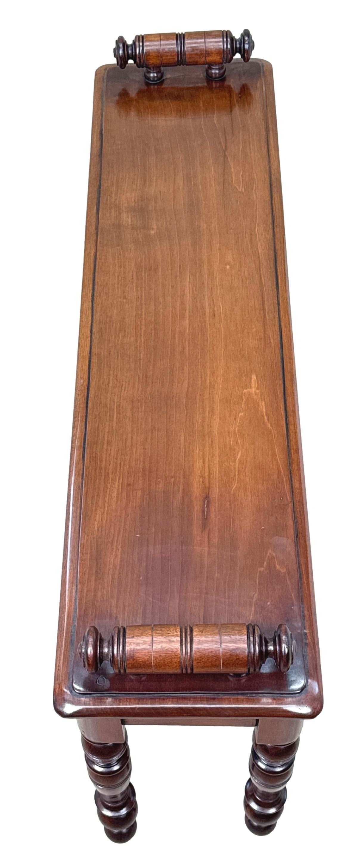 A Good Quality Late 19th Century Mahogany Window Seat, Or Hall Bench, Having Well Figured Rectangular Top With Turned Rolls To Each End, Over Panelled Frieze, Raised On Attractive Bulbous Ring Turned Legs.

Hall benches from the 19th century often