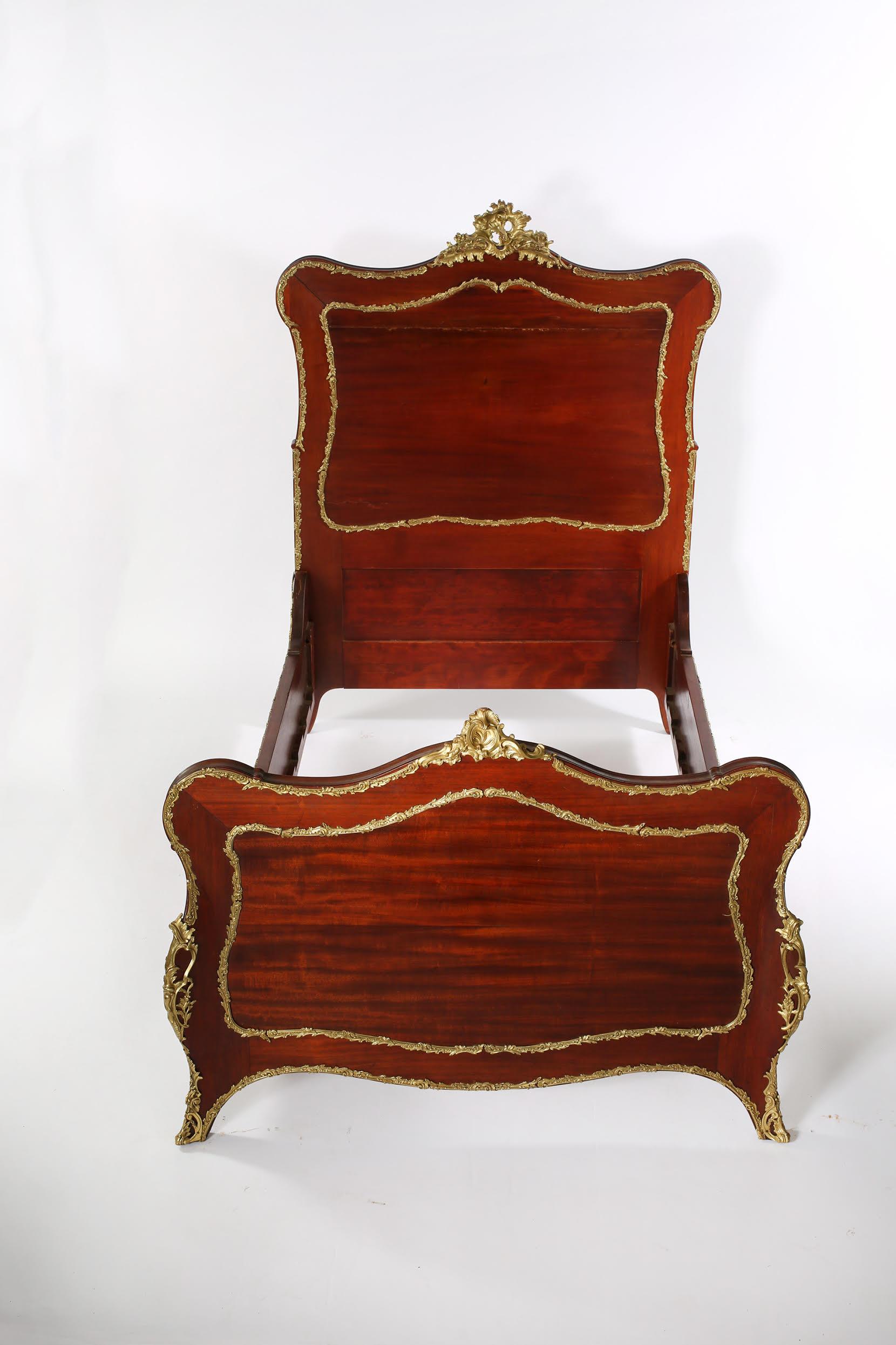 Superb craftsmanship and elegant adornment details characterize these exceptional hand carved matching pair of mahogany wood single beds with superior craftsmanship design details. Each bed is in great antique condition with appropriate wear