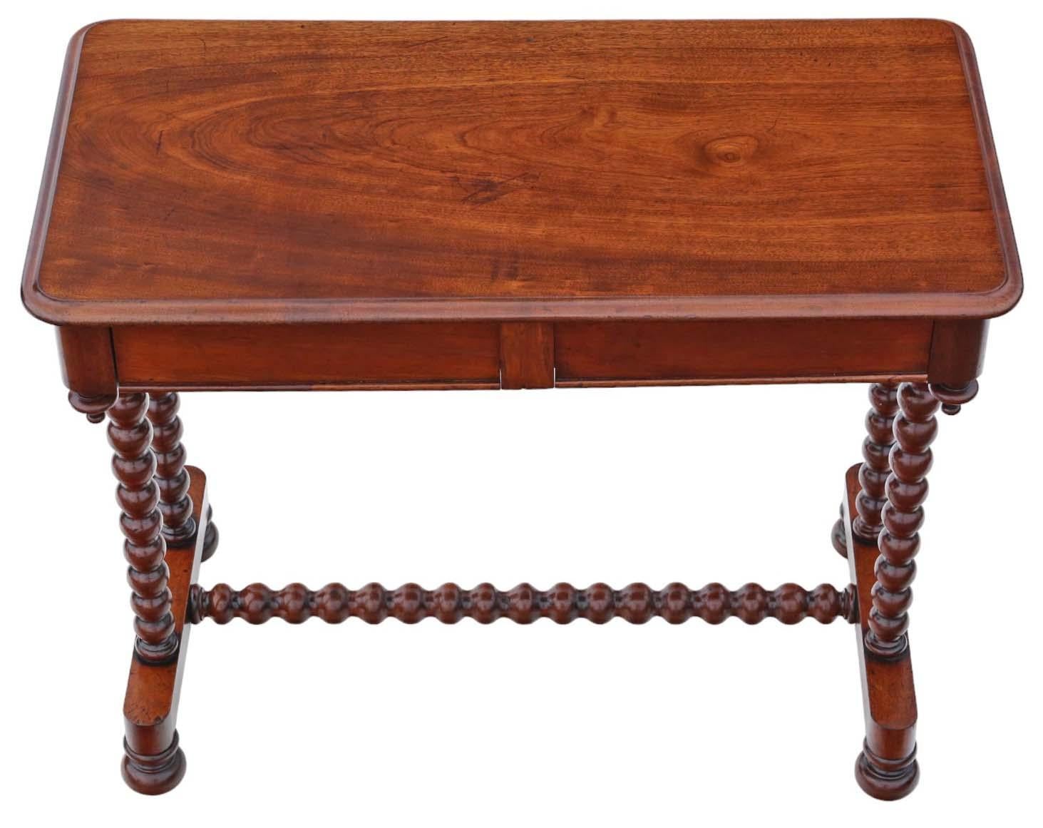 Introducing an Antique Fine Quality 19th Century Bobbin Turned Mahogany Writing Table, versatile as a desk, dressing, lamp, or large bedside table, showcasing a decorative design with two blind drawers.

Recently restored, the finishes of this