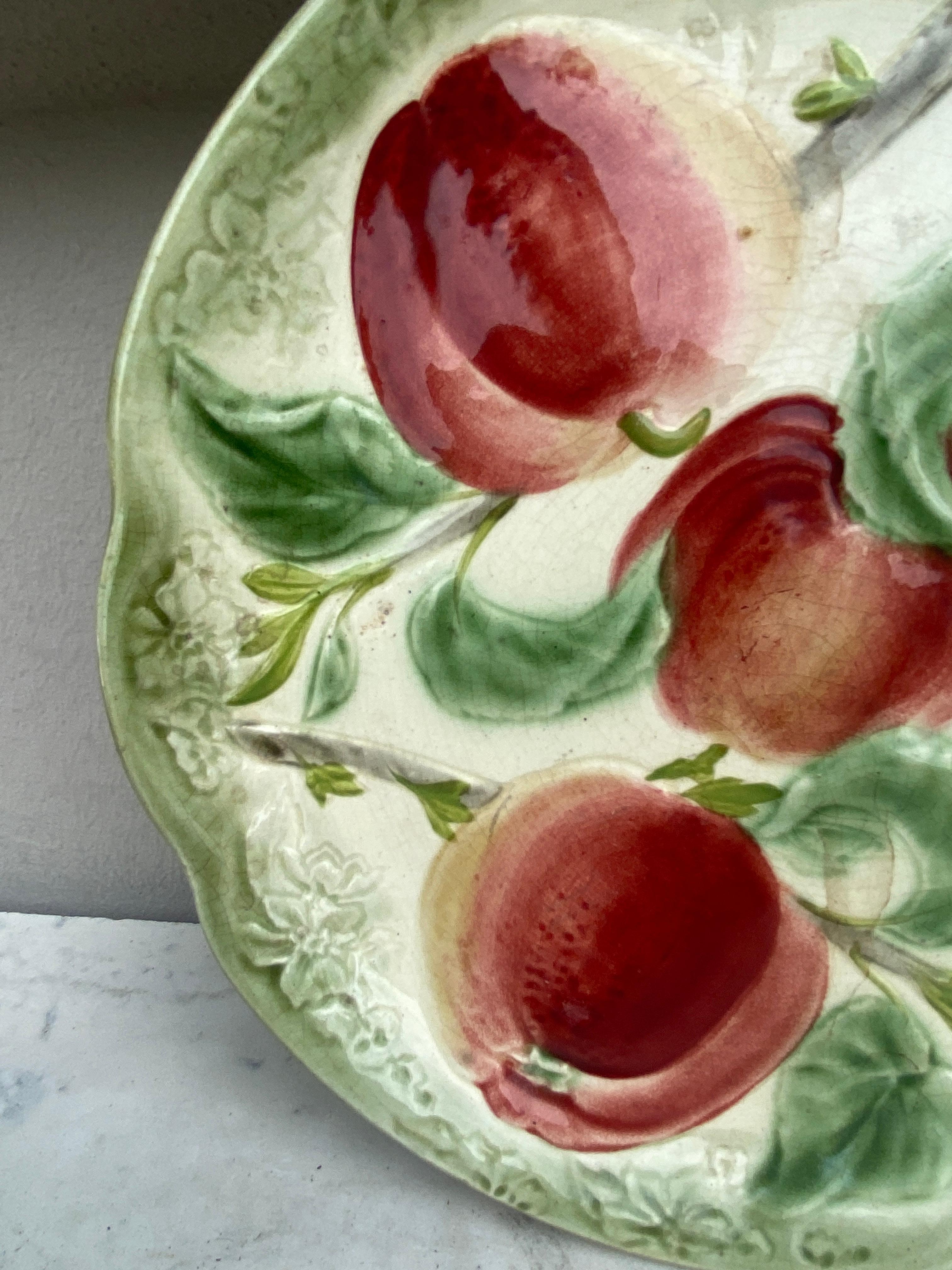 19th century Majolica Apples plate signed Choisy Le Roi.
Made for Higgins & Setter New York.
The Higgins & Seiter Company of New York City began selling decorations for the table, including rich-cut glass in 1887. By 1891 the firm was