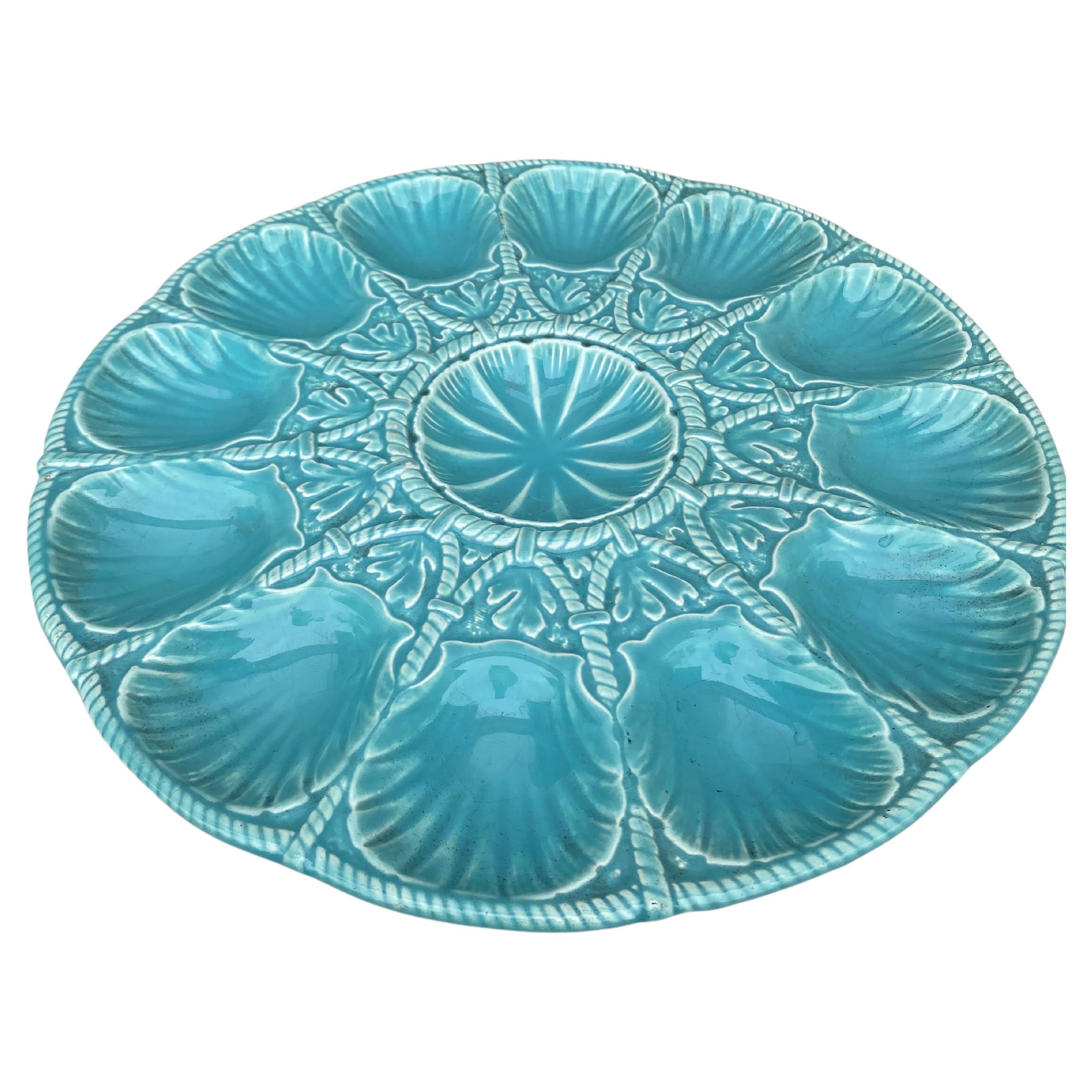 Oversize 19th Century Majolica turquoise aqua oyster platter signed Sarreguemines.
The platter have 12 shells between rope pattern and seaweeds.
 