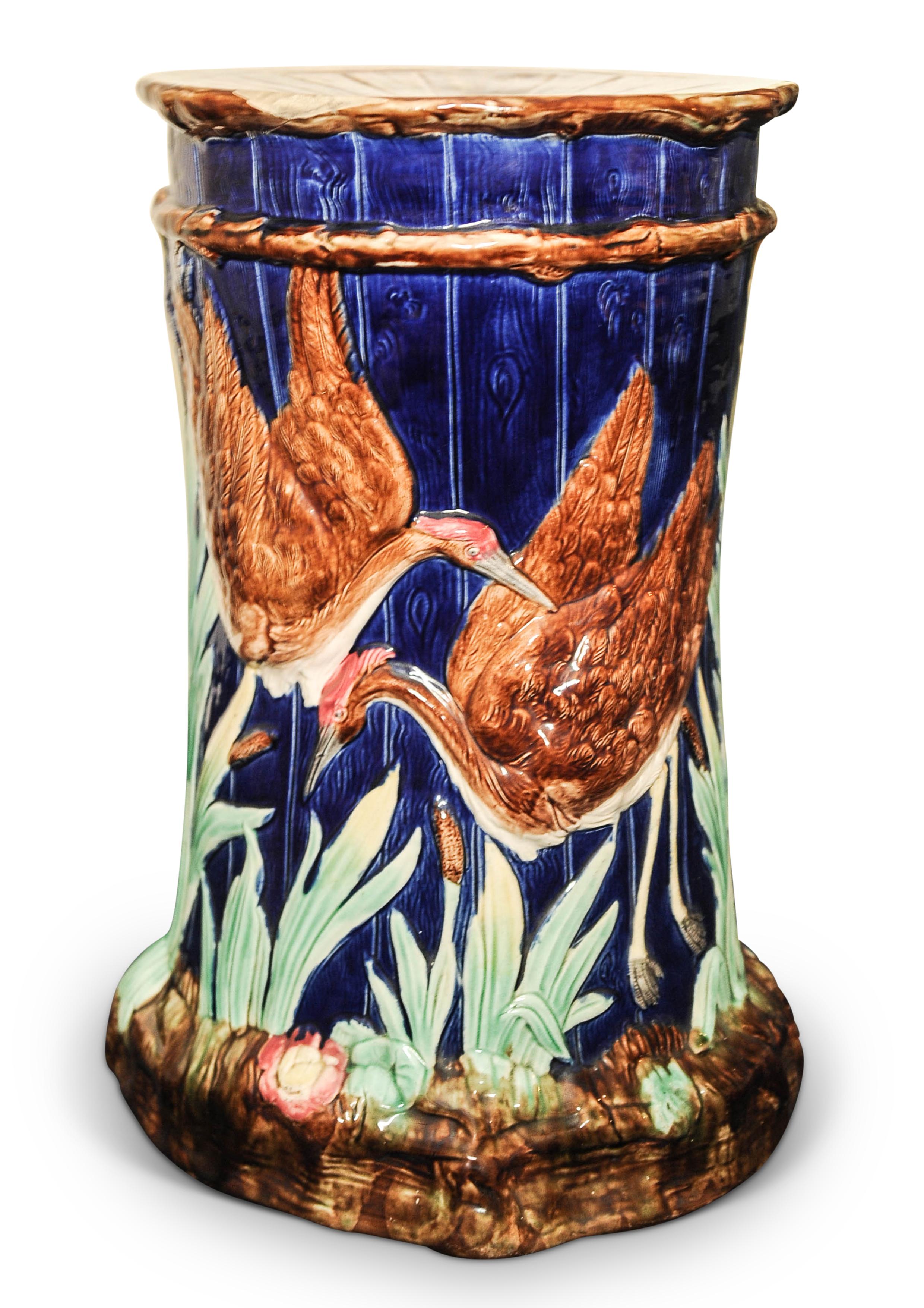A Late 19th Art Nouveau Thomas Forester & Sons Majolica Ceramic Colbalt Blue Garden Stool Circa 1881-1900

Features a decorative Numidian crane pattern, on a blue backdrop, with raised cranes and foliage, with a pierced seat to the top.

Thomas
