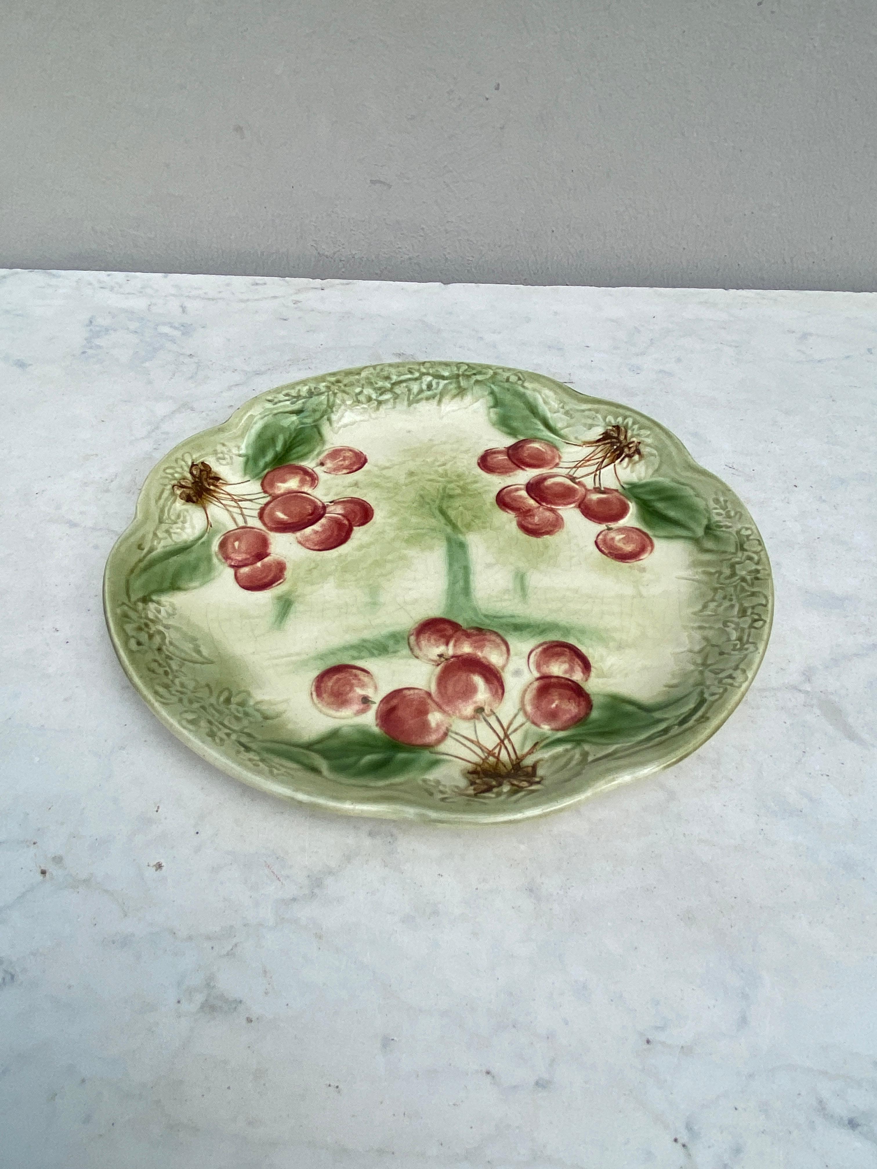 19th century Majolica Cherries Plate signed Choisy Le Roi.
Made for Higgins & Setter New York.
The Higgins & Seiter Company of New York City began selling decorations for the table, including rich-cut glass in 1887. By 1891 the firm was