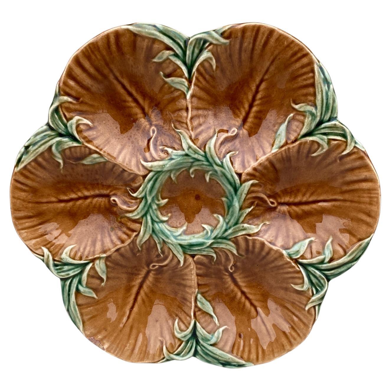 19th Century Majolica chocolate oyster plate with green seaweeds Luneville.
Reference: Page 43 