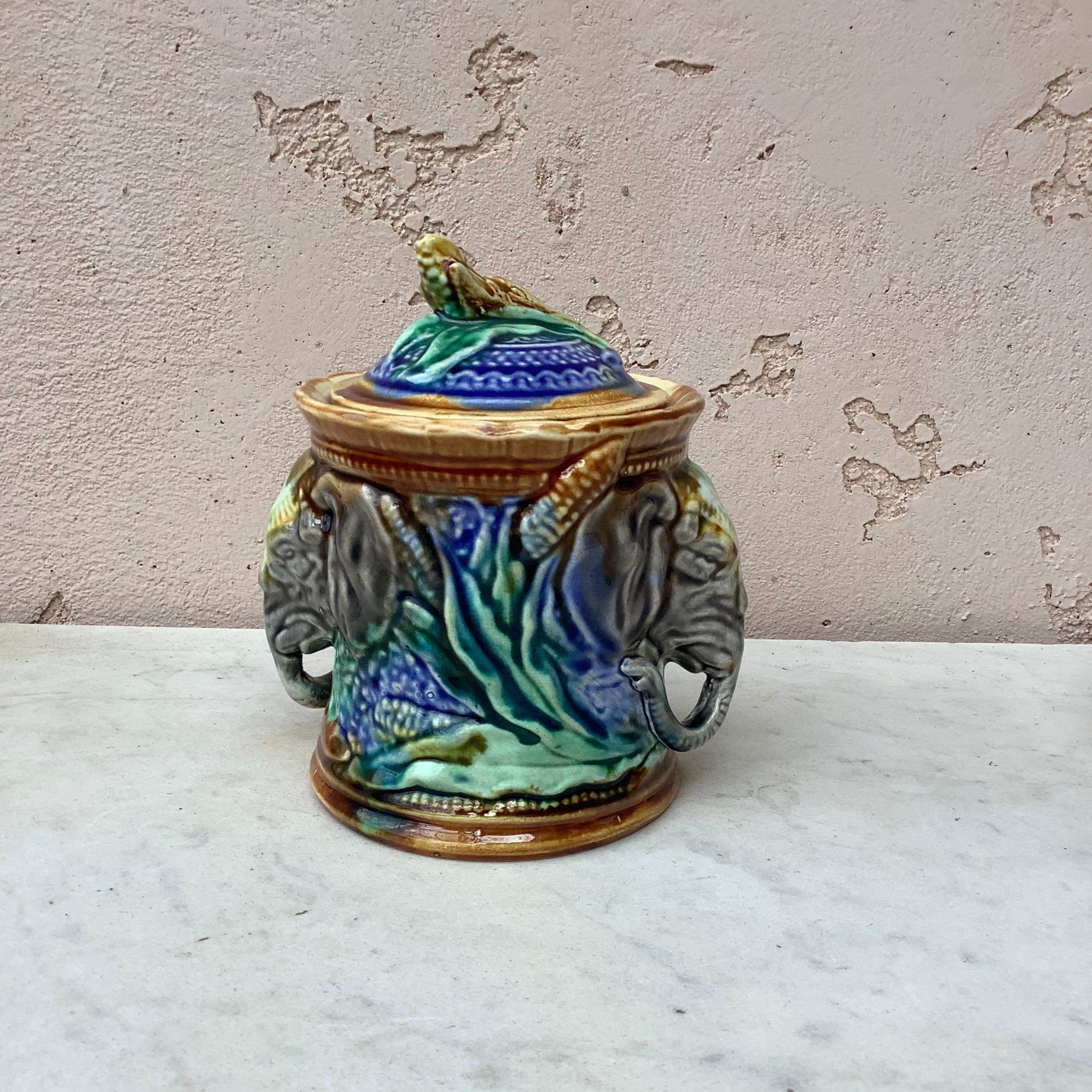 Majolica tobacco jar signed Onnaing, circa 1890.
The two handles are elephants heads, decorated with corn, the handle of the jar is a corn.