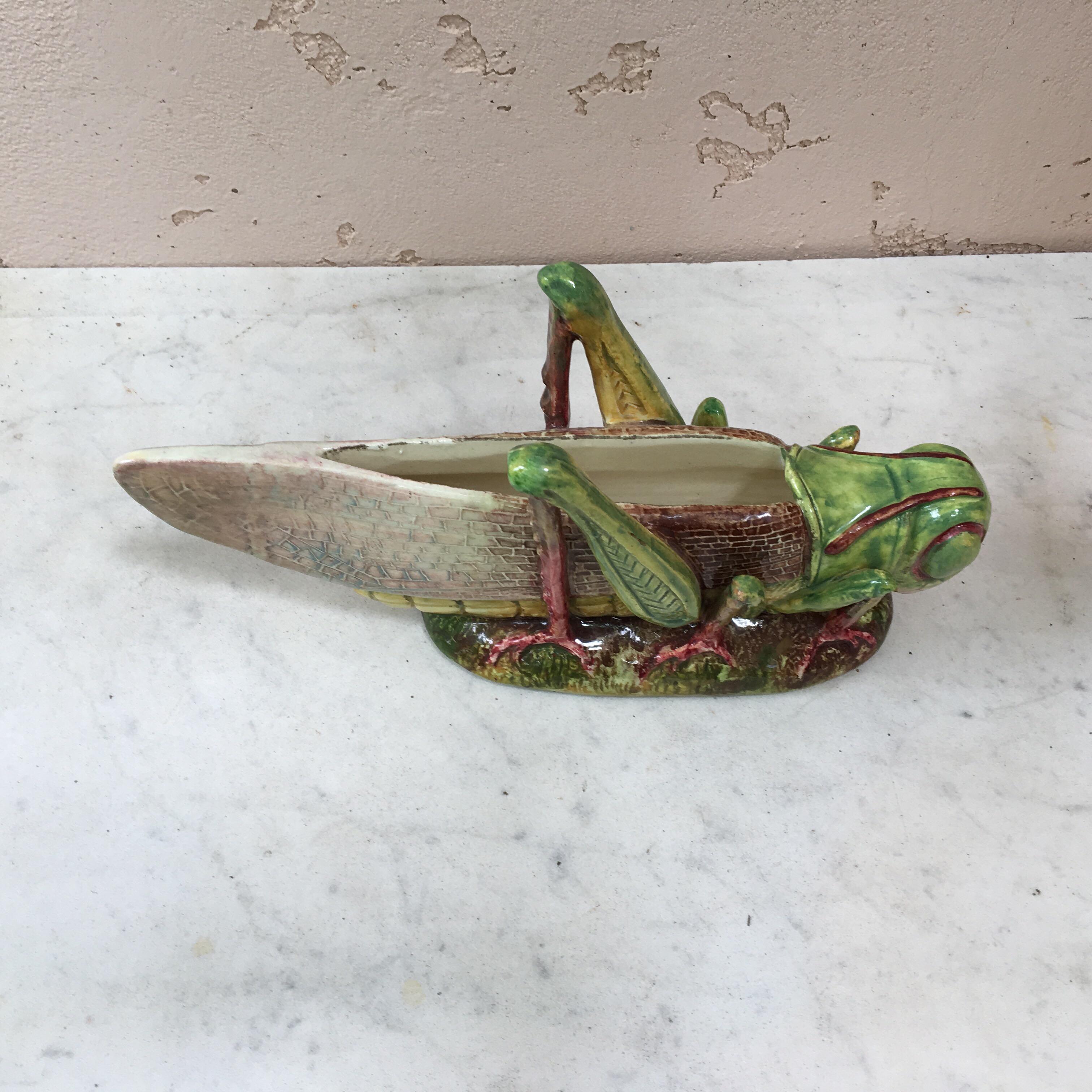 Rare Majolica grasshopper jardinière signed Jerome Massier Fils, circa 1890.
This grasshopper is a medium size.
At the end of 19th century The Massier manufacture participated at the Universal Exhibitions and earned several prices. This piece is a