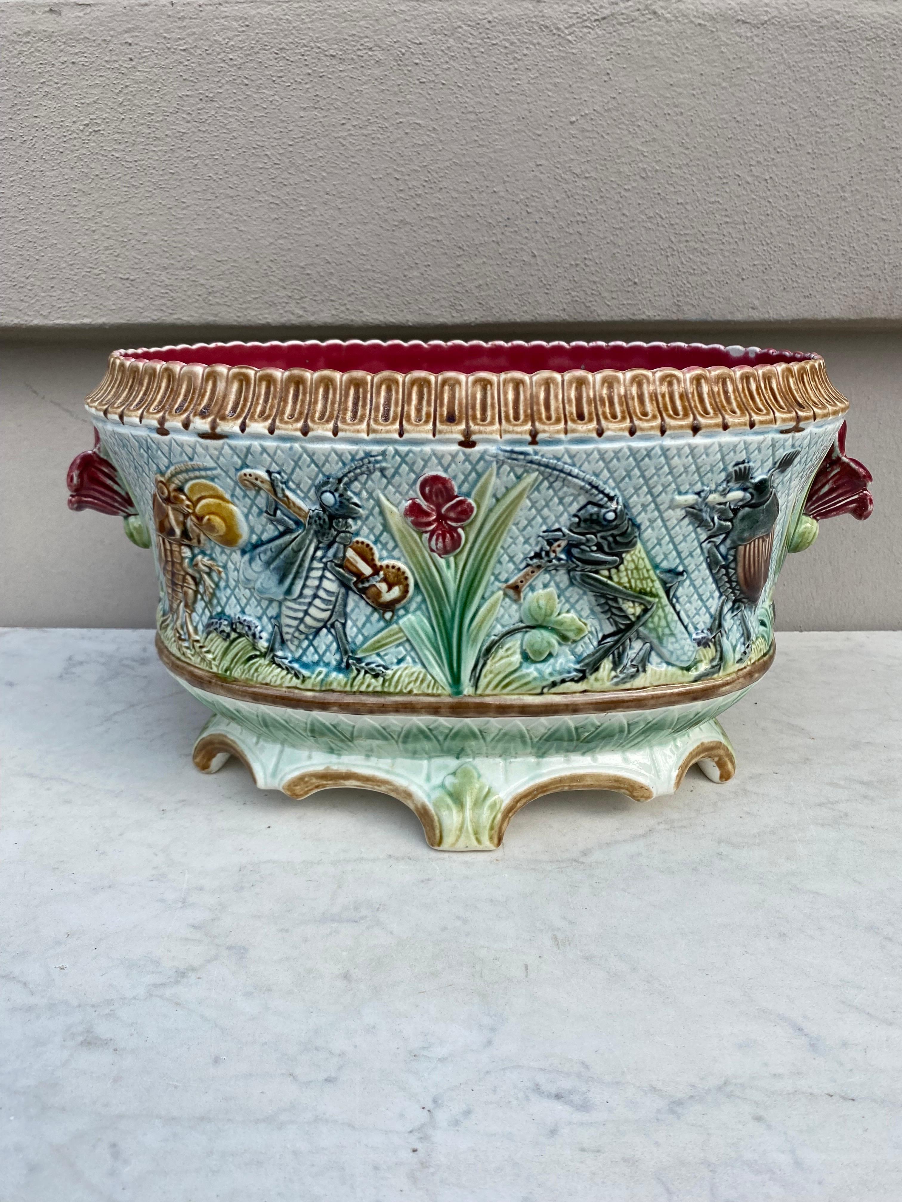 Unusual and humoristic 19th French Majolica jardinière with insects playing musicals instruments.
Decorated with leaves and flowers.