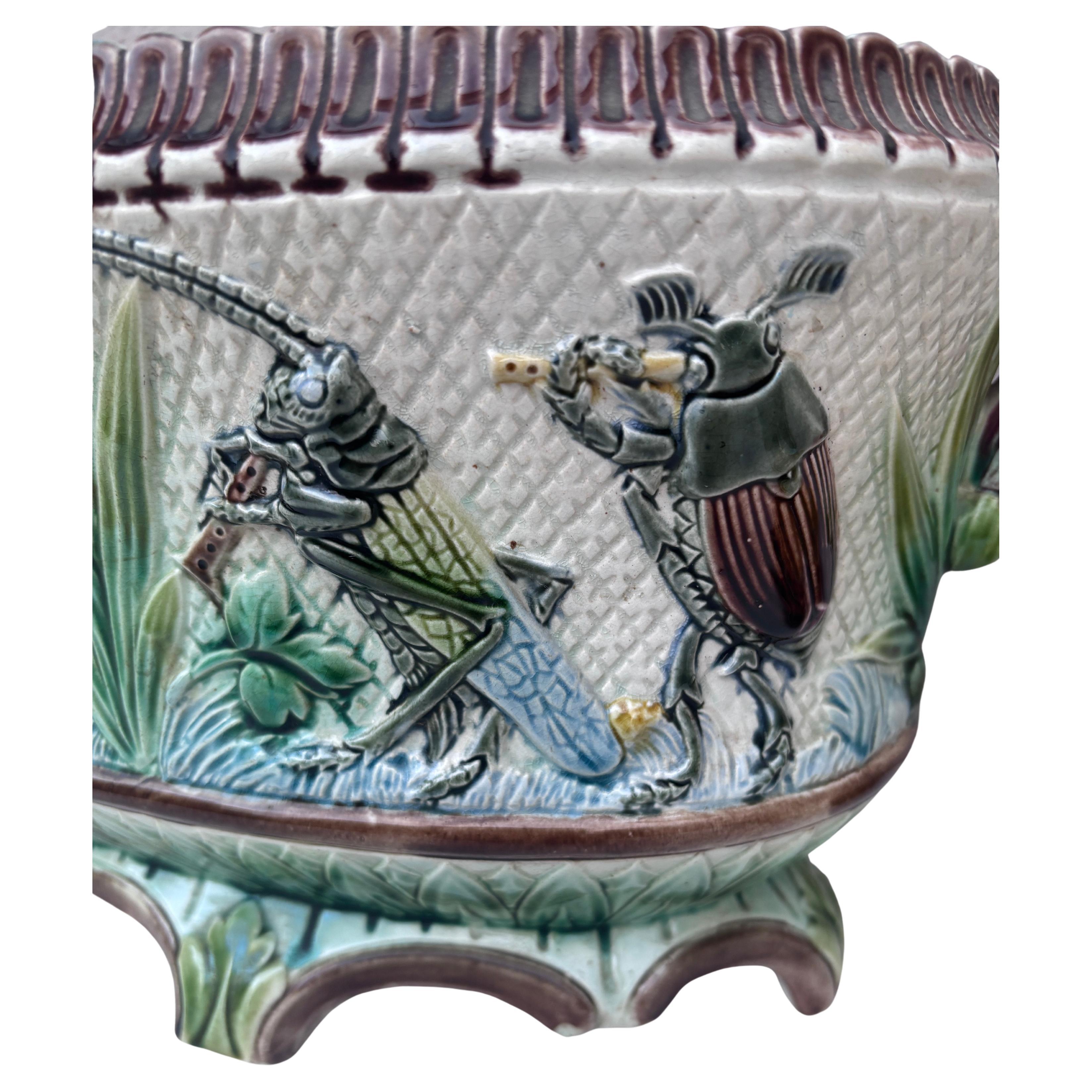 Unusual and humoristic 19th French Majolica jardinière with insects playing musicals instruments.
Decorated with leaves and flowers.