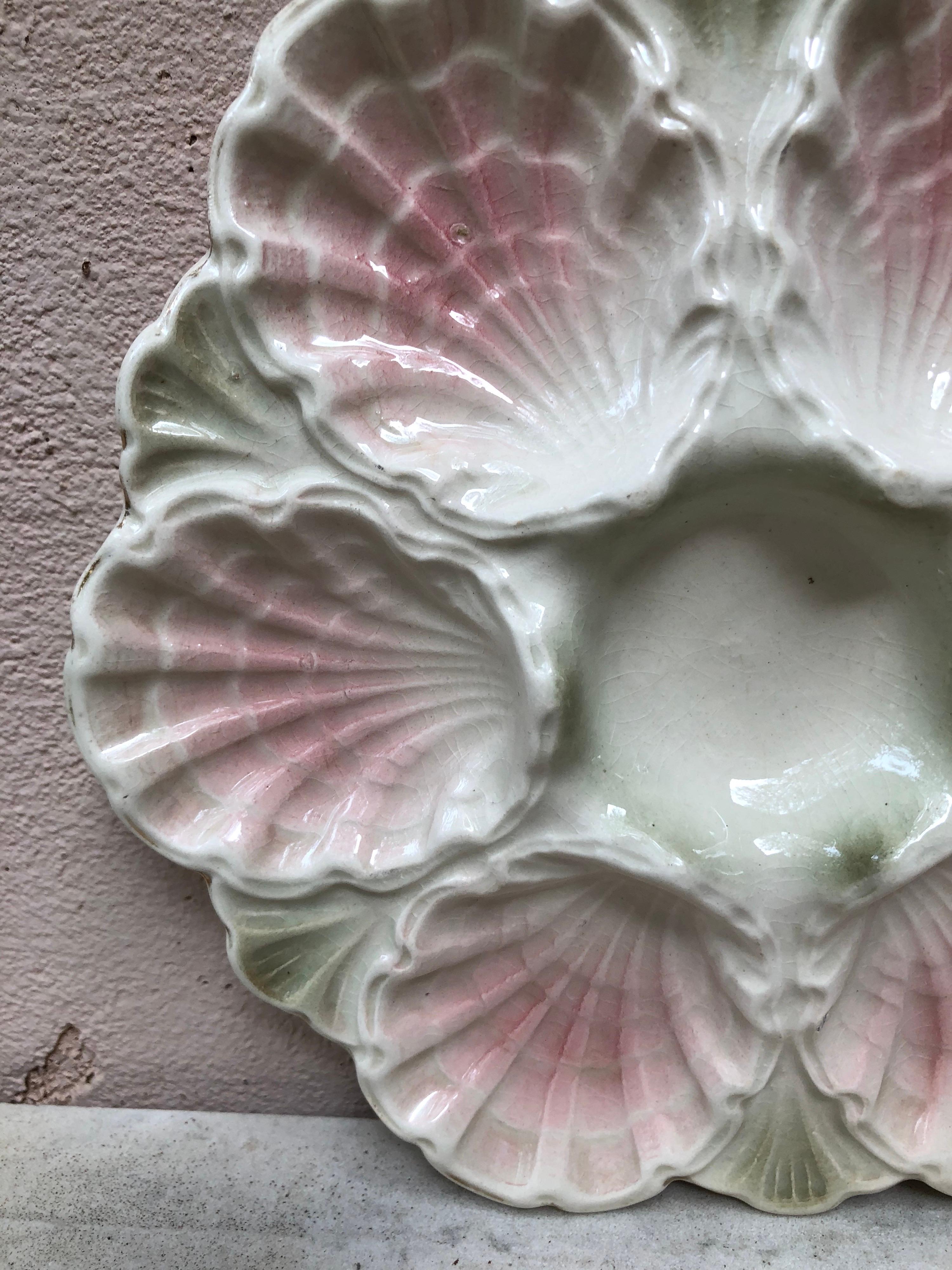 Lovely rare Majolica pink iridescent oyster plate attributed to fives Lille, circa 1890.
 