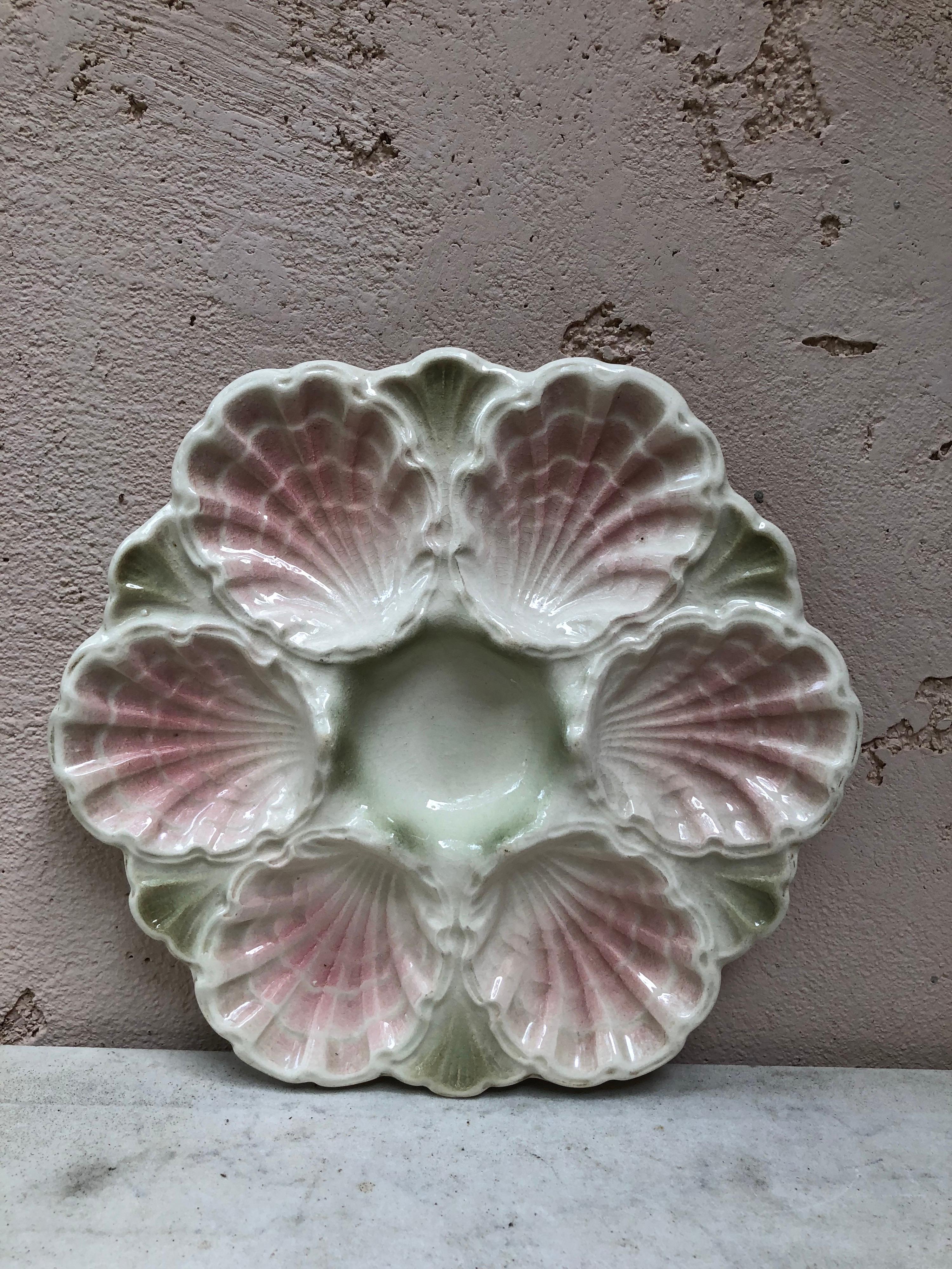 Lovely Rare Majolica pink iridescent oyster plate attributed to Fives Lille, circa 1890.
 