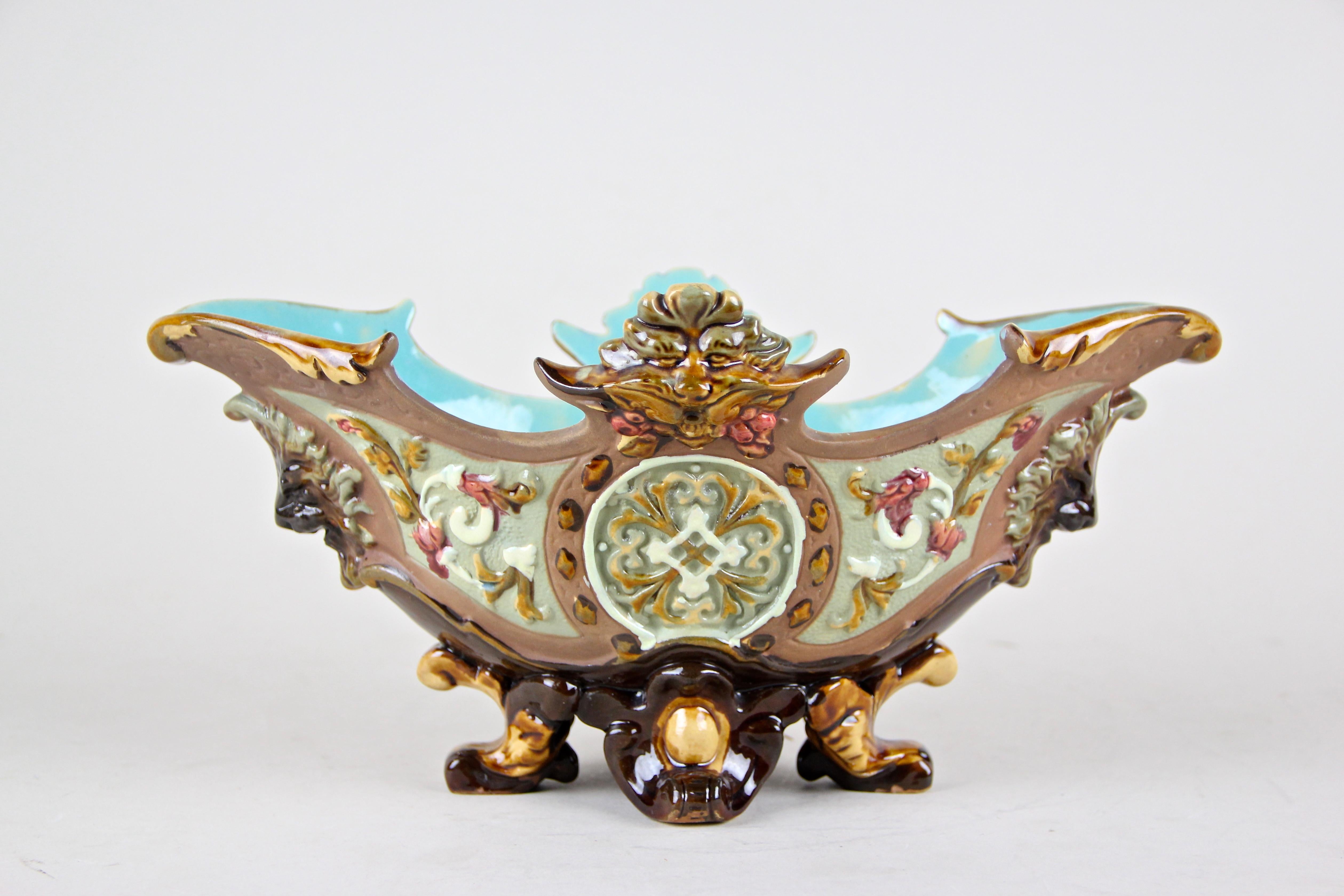 Delightful 19th century Majolica Jardinière out of the renown workshops of Wilhelm Schiller & Son in Bohemia around 1890. A beautiful uncommon shaped small jardiniere coming with a lovely hand-painted floral design - typical for pieces out of this