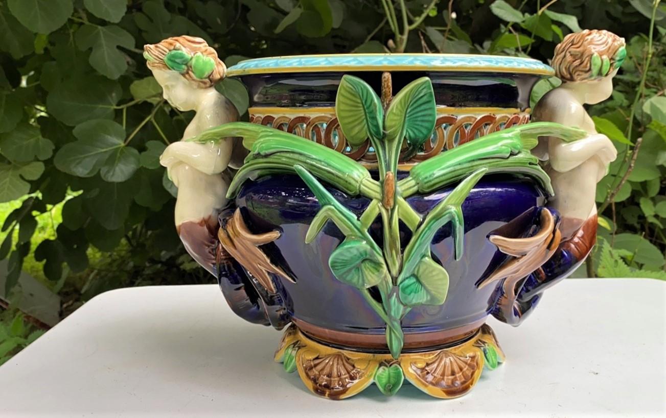 Large French Majolica Jardiniere with Puttis and plants signed Sarreguemines, Neo Renaissance style.