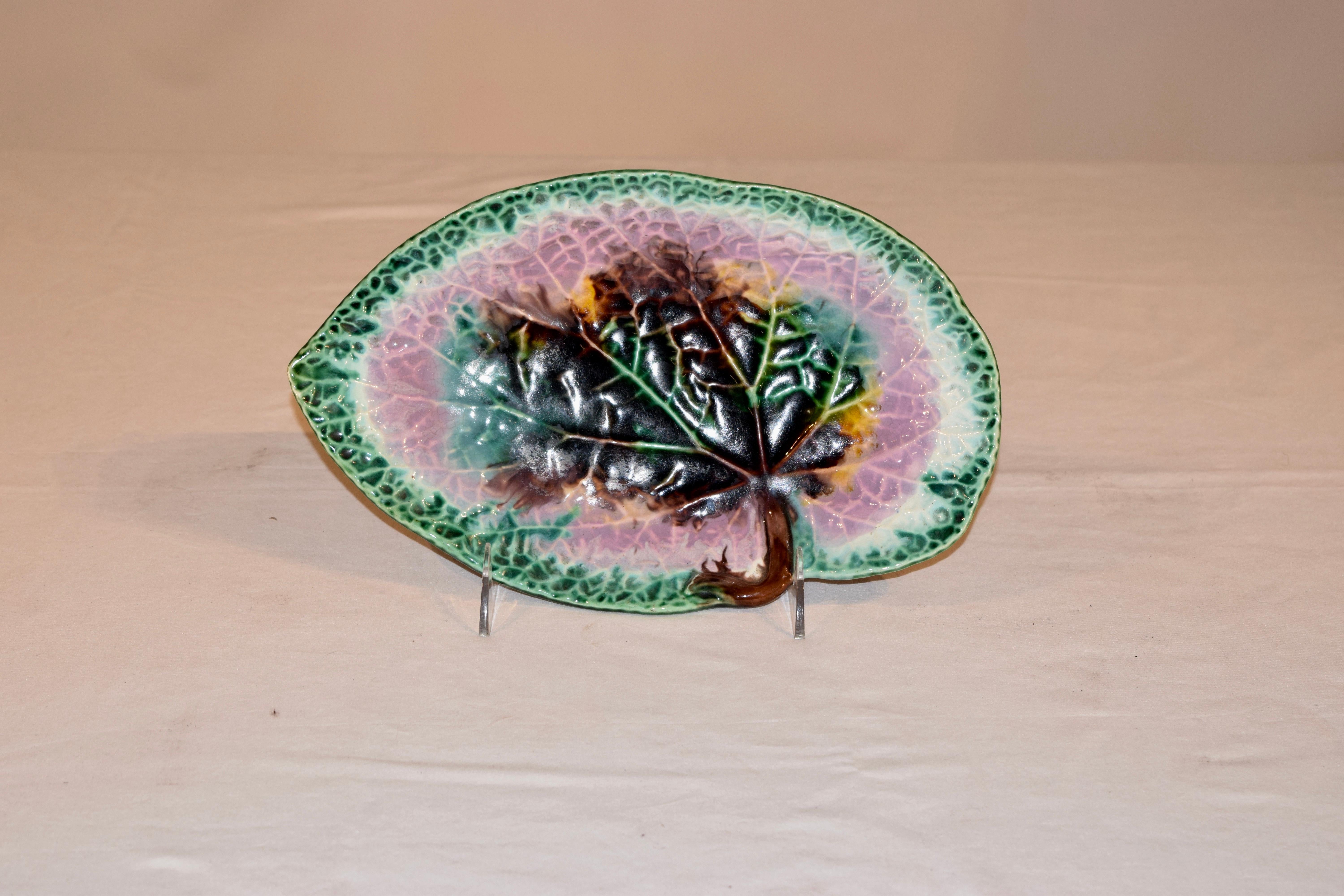 19th century Majolica leaf dish from England. The dish is molded in the shape of a leaf and then glazed very colorfully in shades of green, pink, yellow, brown and white. The leaf is wonderfully figured as well with the views of the leaf very