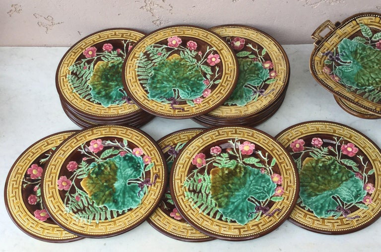 Majolica plate signed Choisy le Roi, circa 1890.
Decorated with leaves, ferns, pink flowers and Greek border.
18 plates available size 8.5